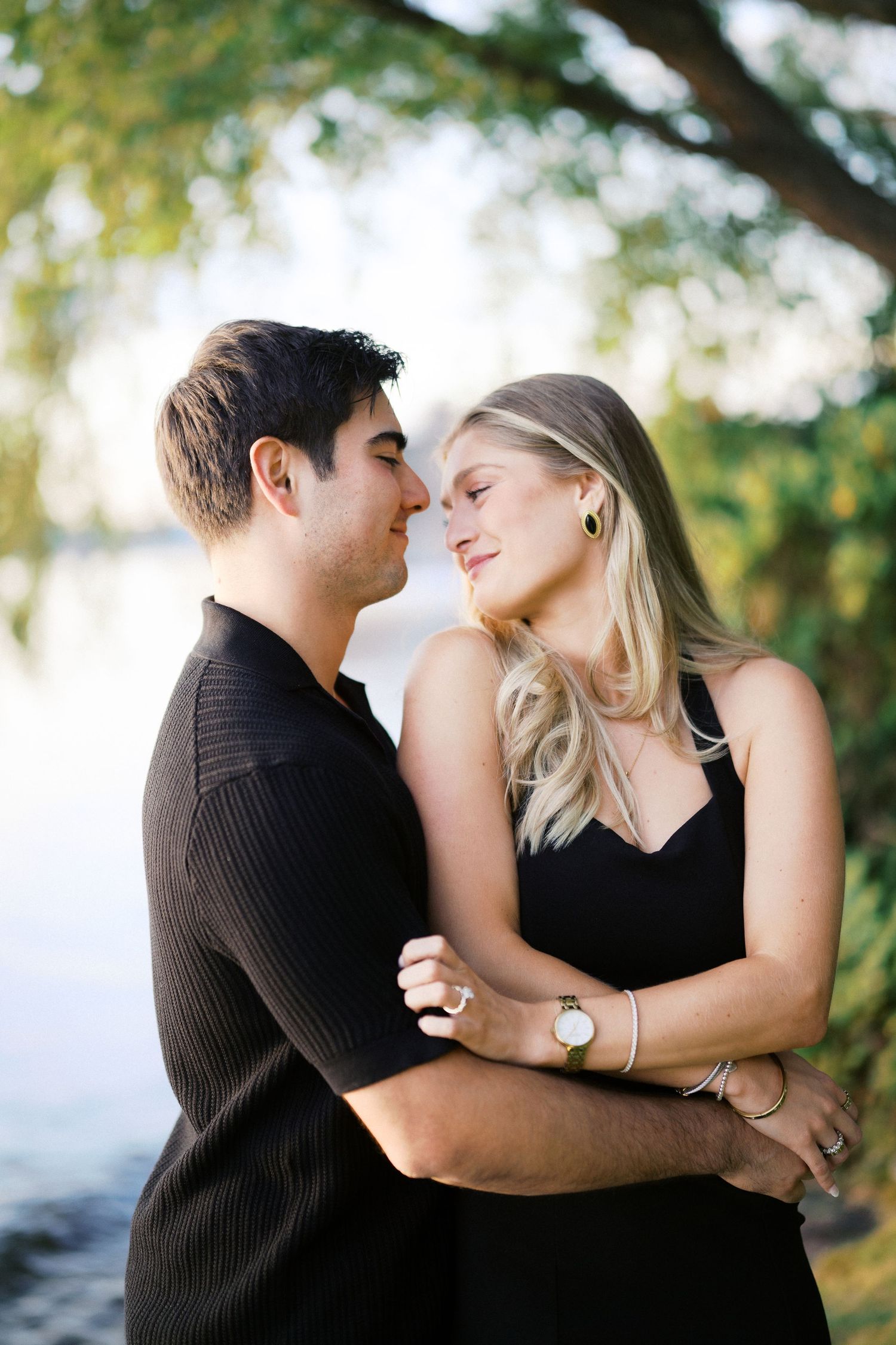 Foreheads together by Lake Washington at Carillon Point, Kirkland engagement portrait