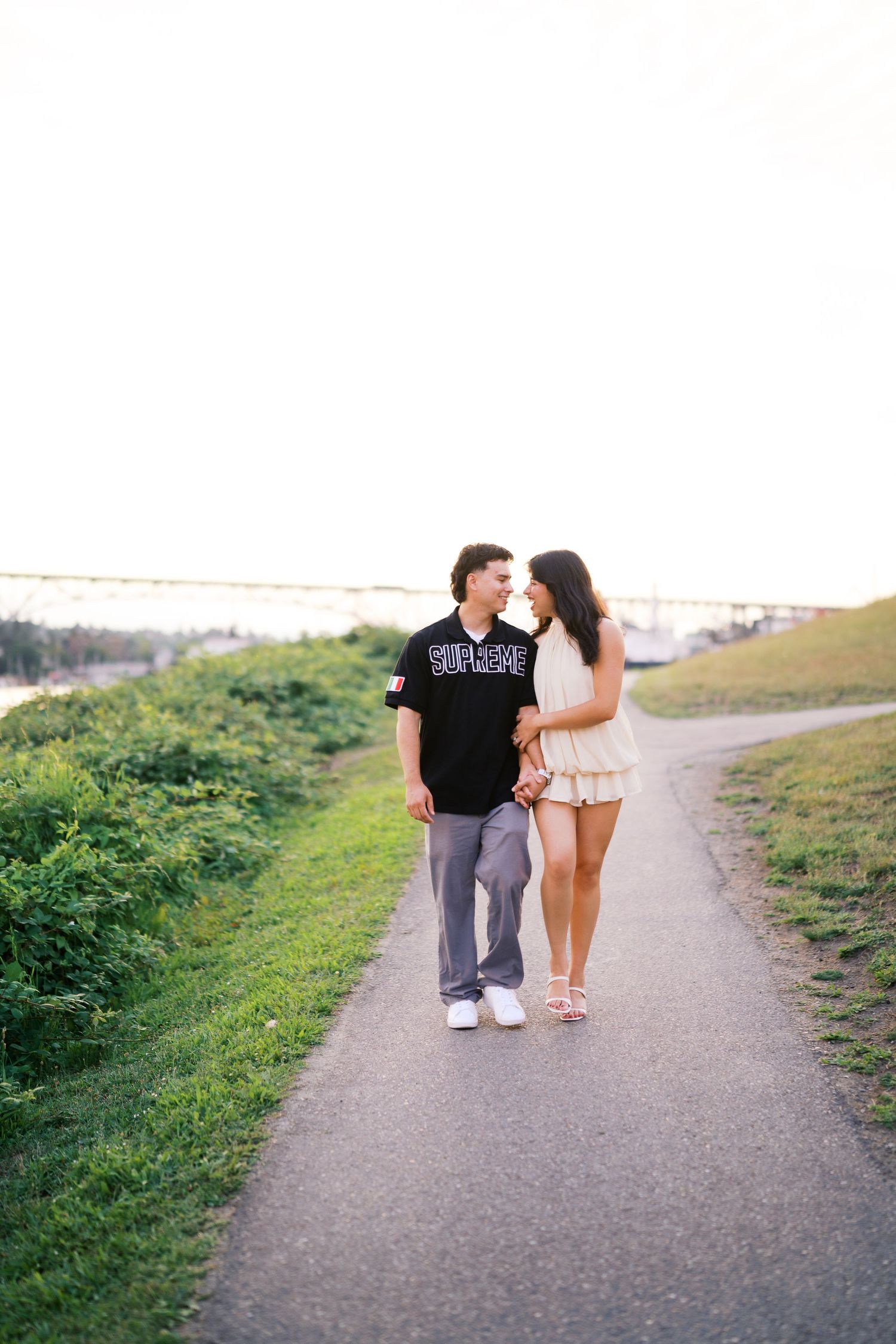 Newly engaged couple walking the path at Gas Works Park, Seattle engagement photos