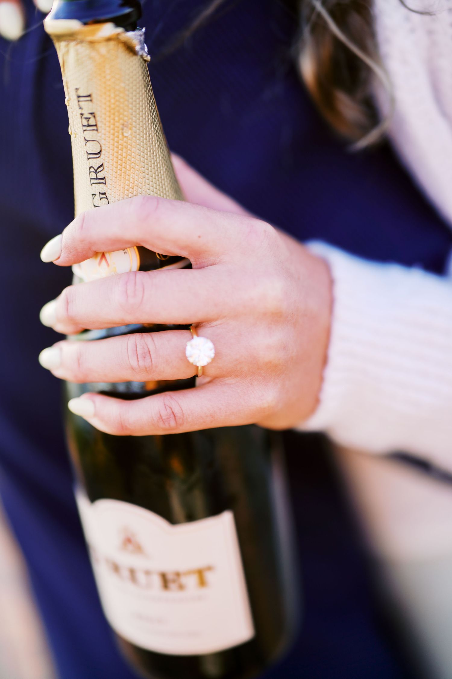 The engagement ring resting on the champagne bottle, Discovery Park proposal photographer, Seattle