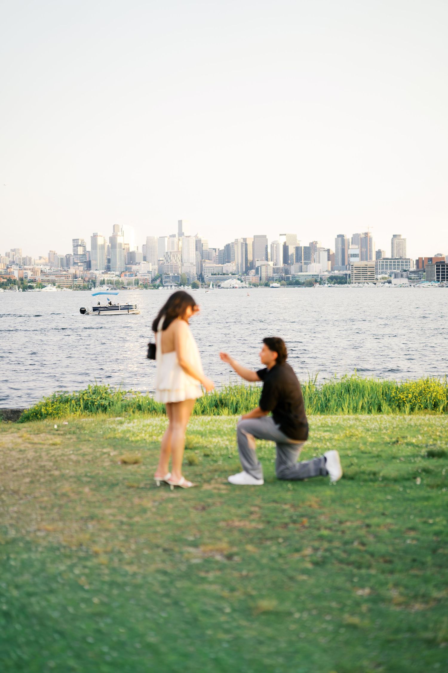 The proposal on the grass with Lake Union behind, Gas Works Park proposal photographer Seattle