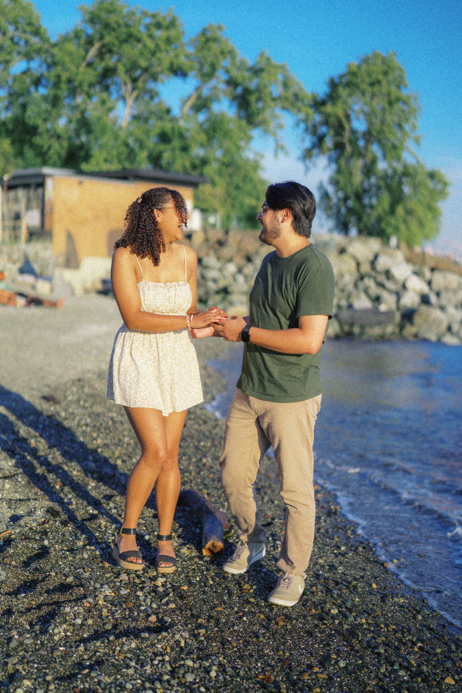 Walking along the water's edge at golden hour, Seattle engagement photographer