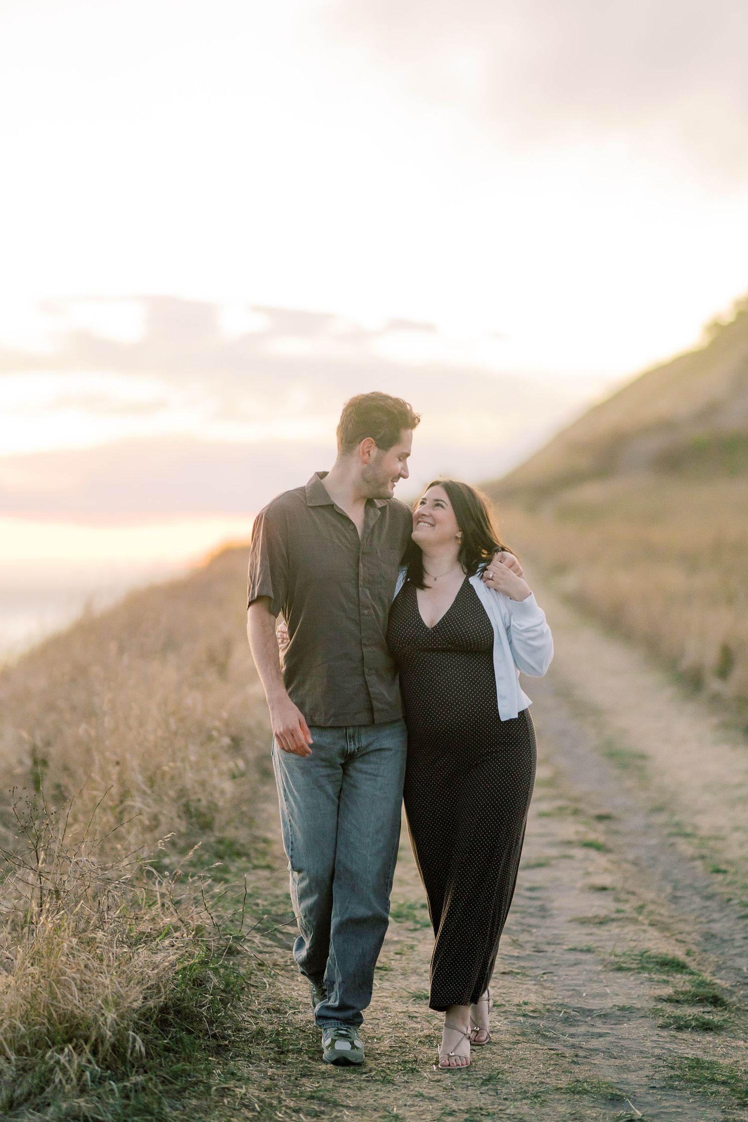Couple walking the hillside path before the proposal, Whidbey Island proposal photographer, Freeland