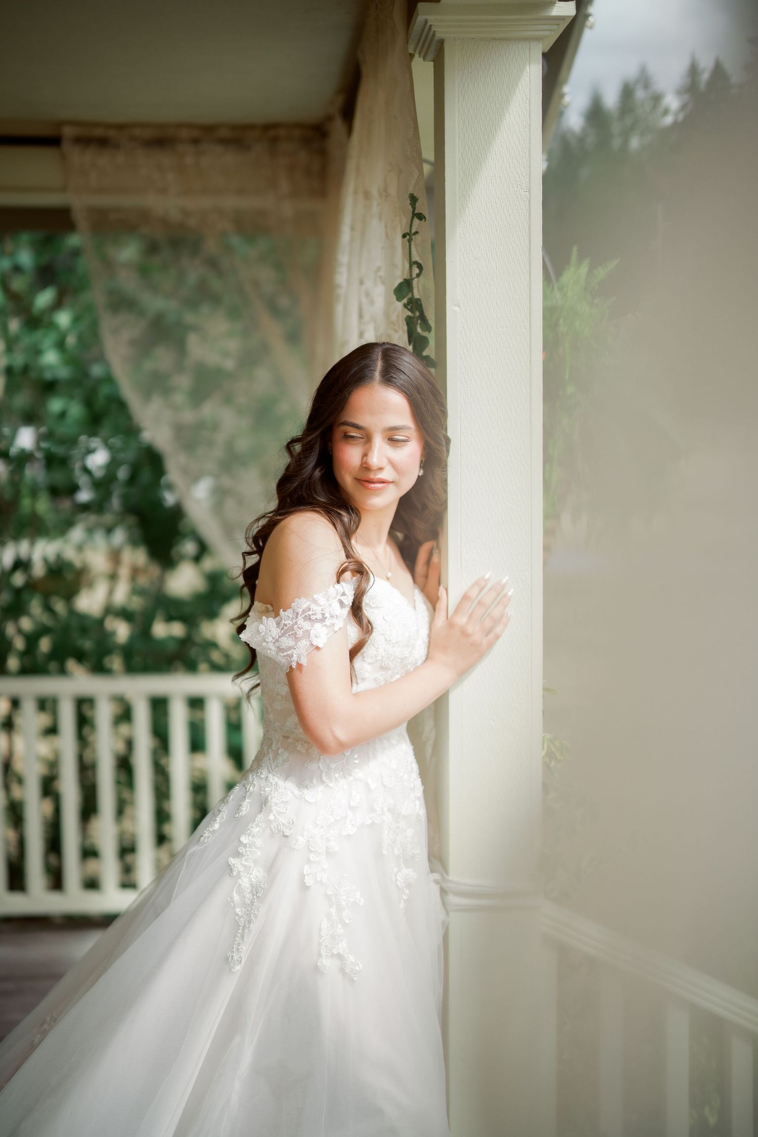 Bride in the farmhouse doorway before her Kelley Farm wedding ceremony