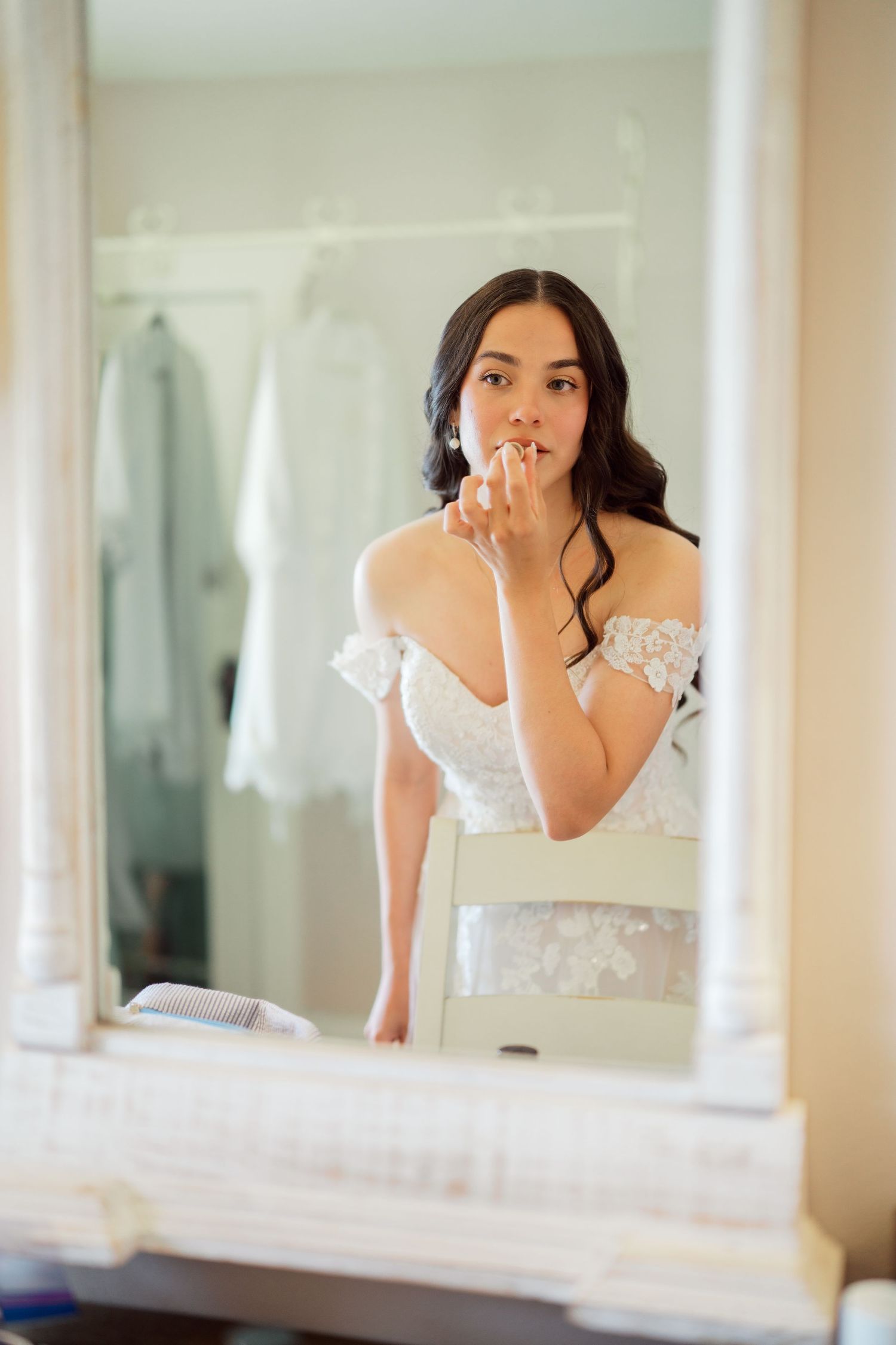 Bride getting ready in the farmhouse mirror at The Kelley Farm, Bonney Lake