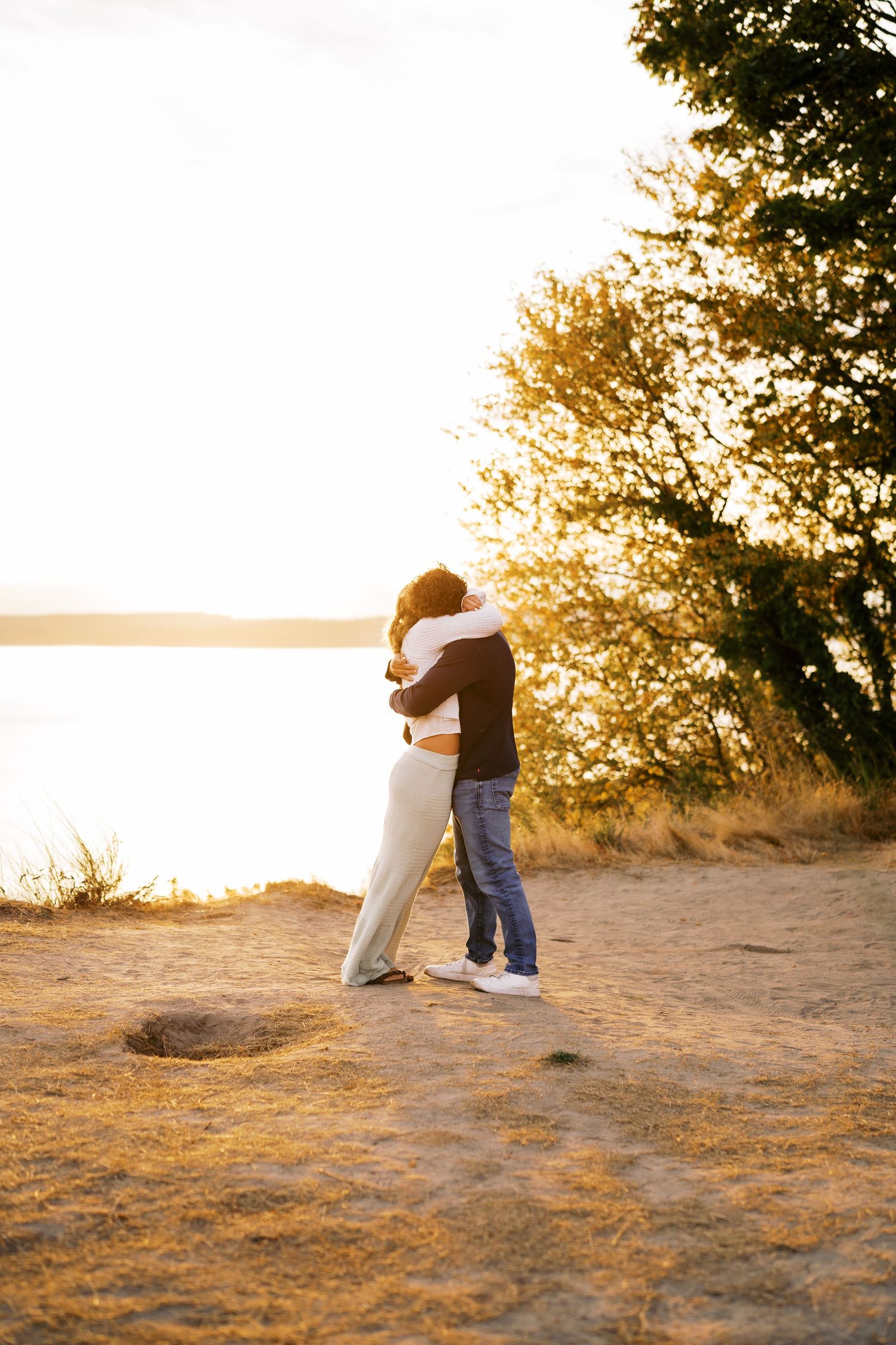 Standing together in the moments after the proposal, Discovery Park proposal photographer, Seattle
