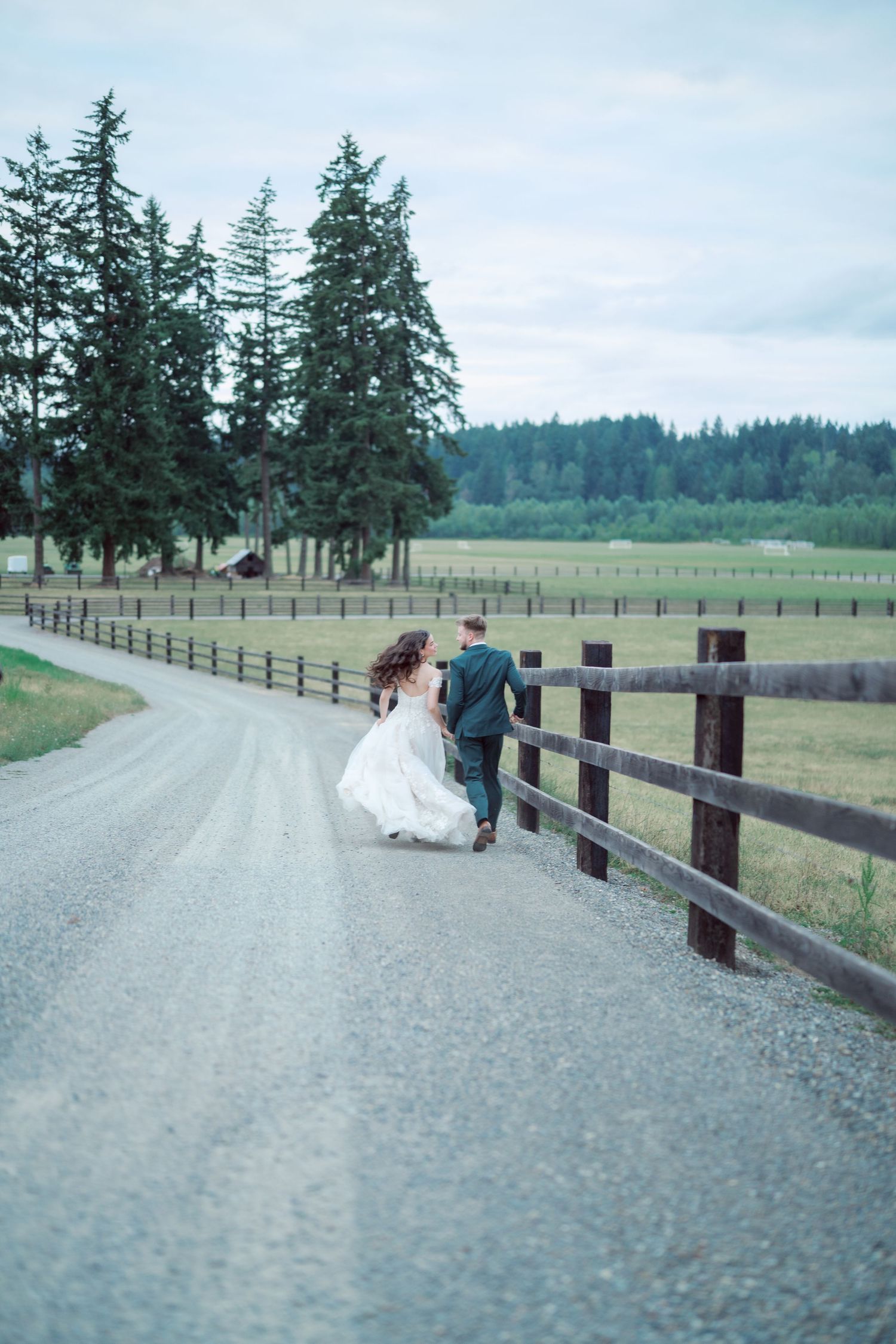 Bride and groom on the farm road at The Kelley Farm in Bonney Lake