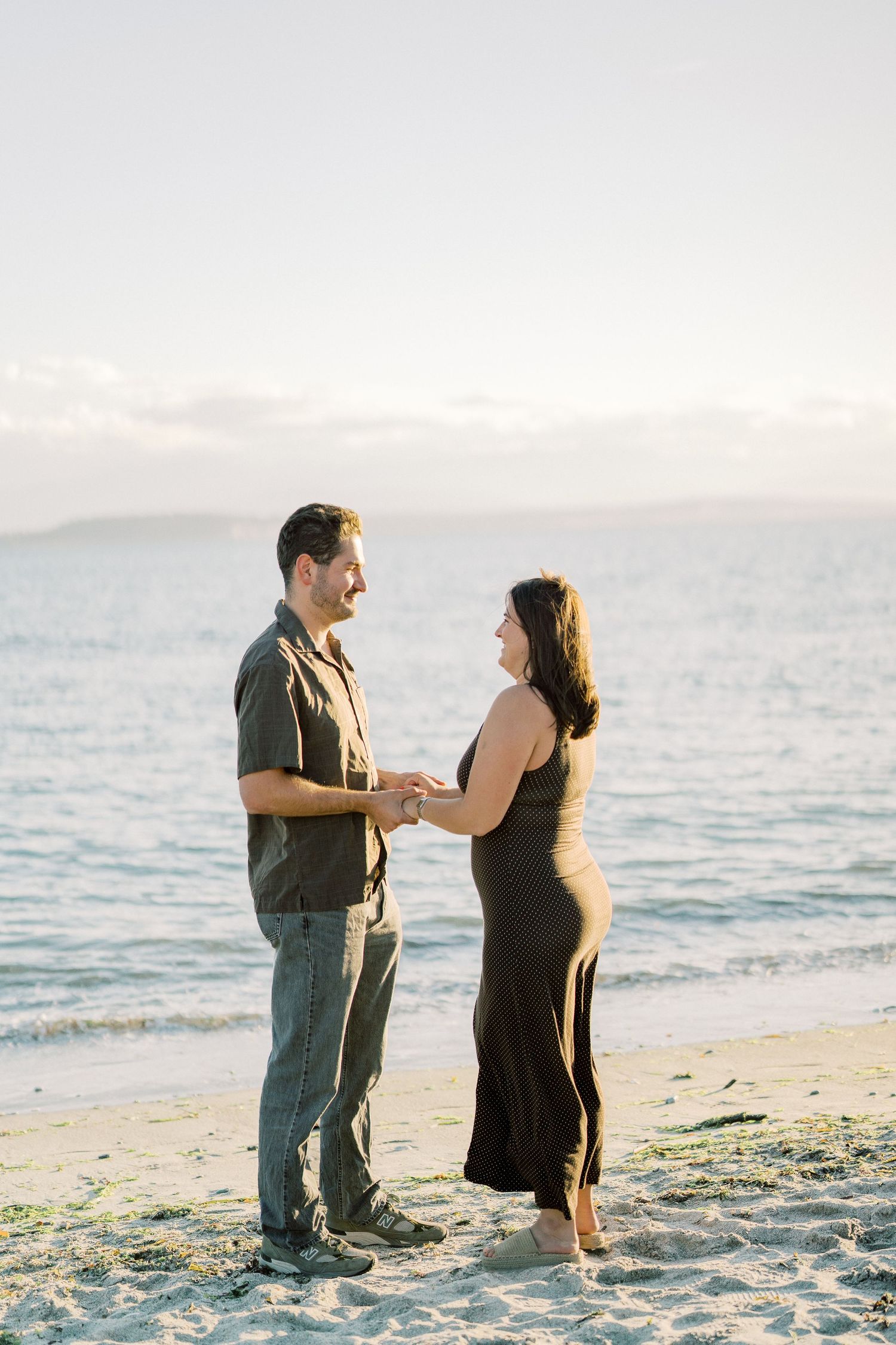 Couple standing at the water's edge just after the proposal, Whidbey Island proposal photographer, Whidbey Island