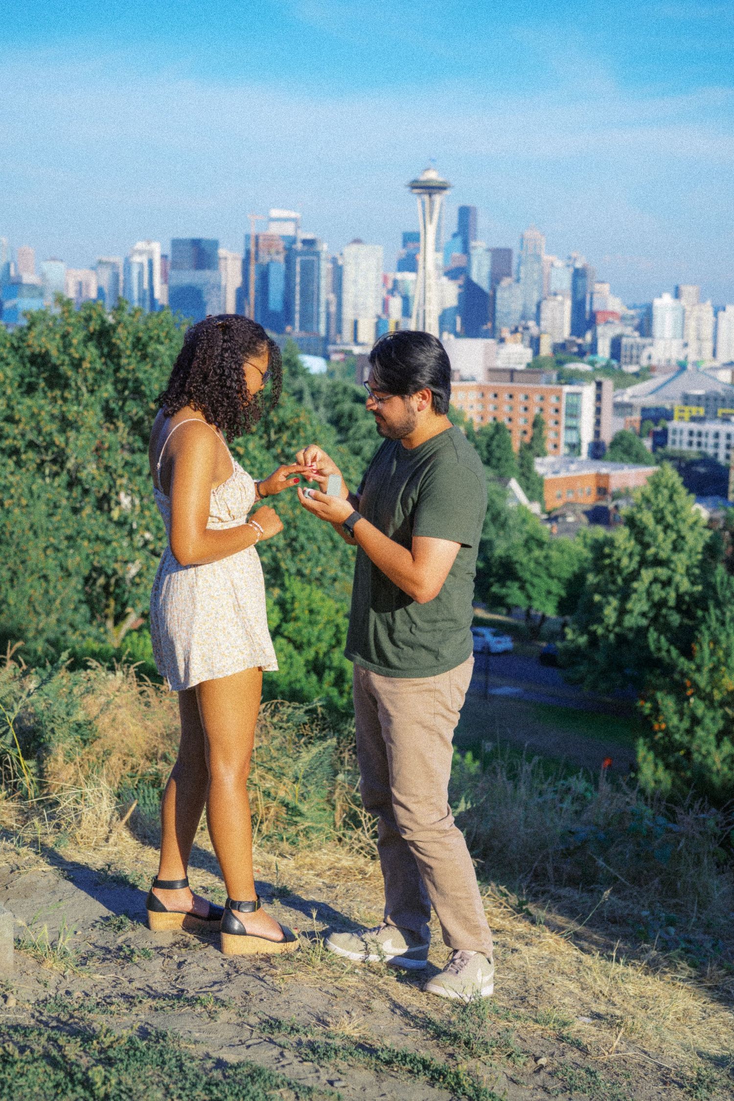 Man on one knee proposing with the Space Needle behind him, Kerry Park proposal photographer, Seattle