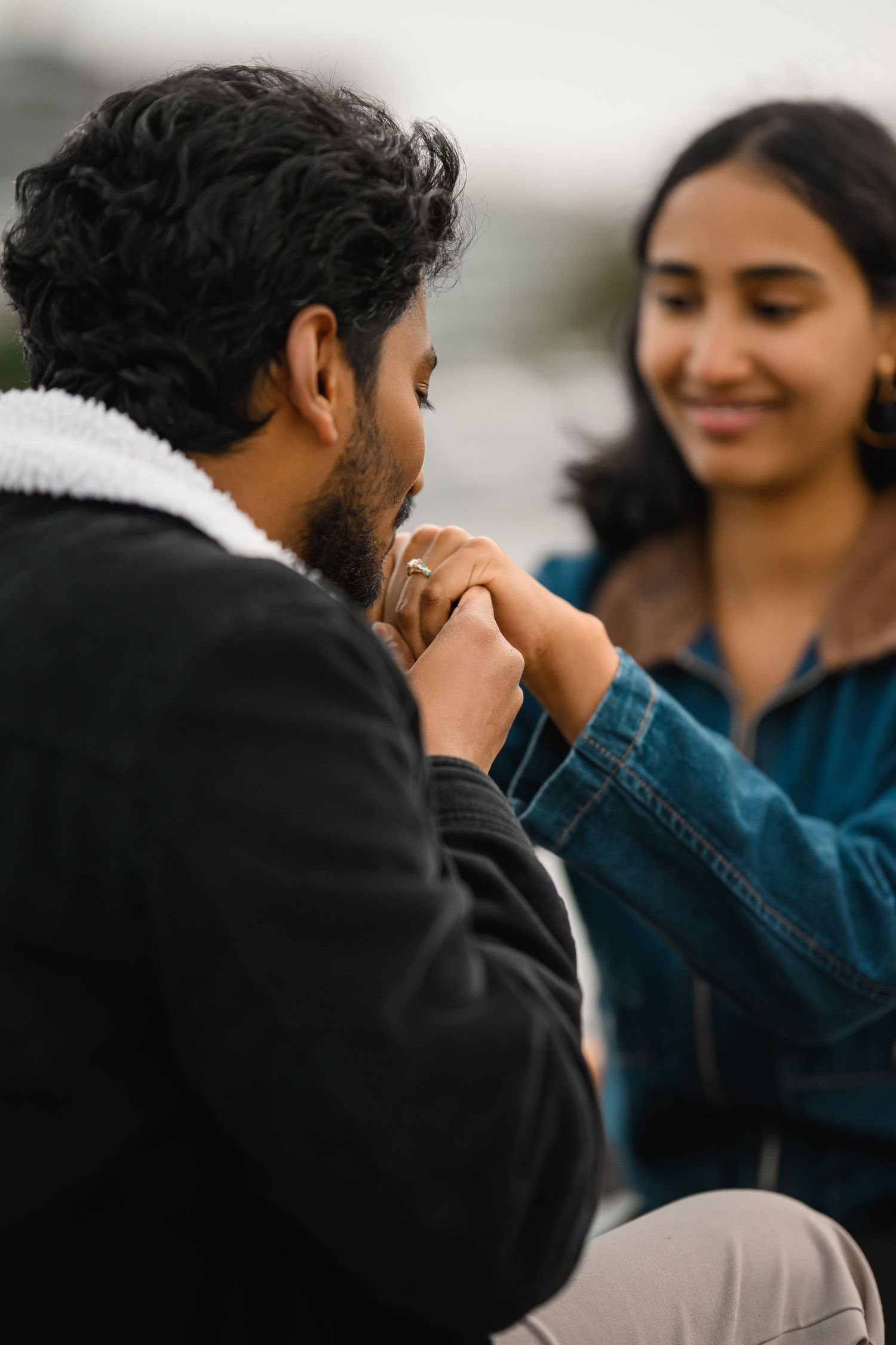Holding her hand in the boat after she said yes, Lake Union proposal photographer, Seattle