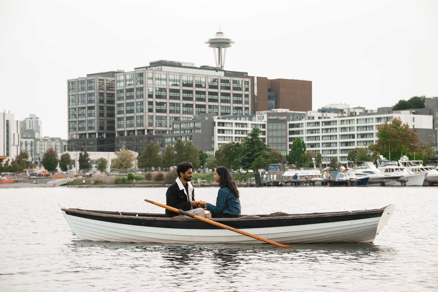 Row boat out on the lake with the Space Needle and the South Lake Union skyline behind, Lake Union proposal photographer, Seattle