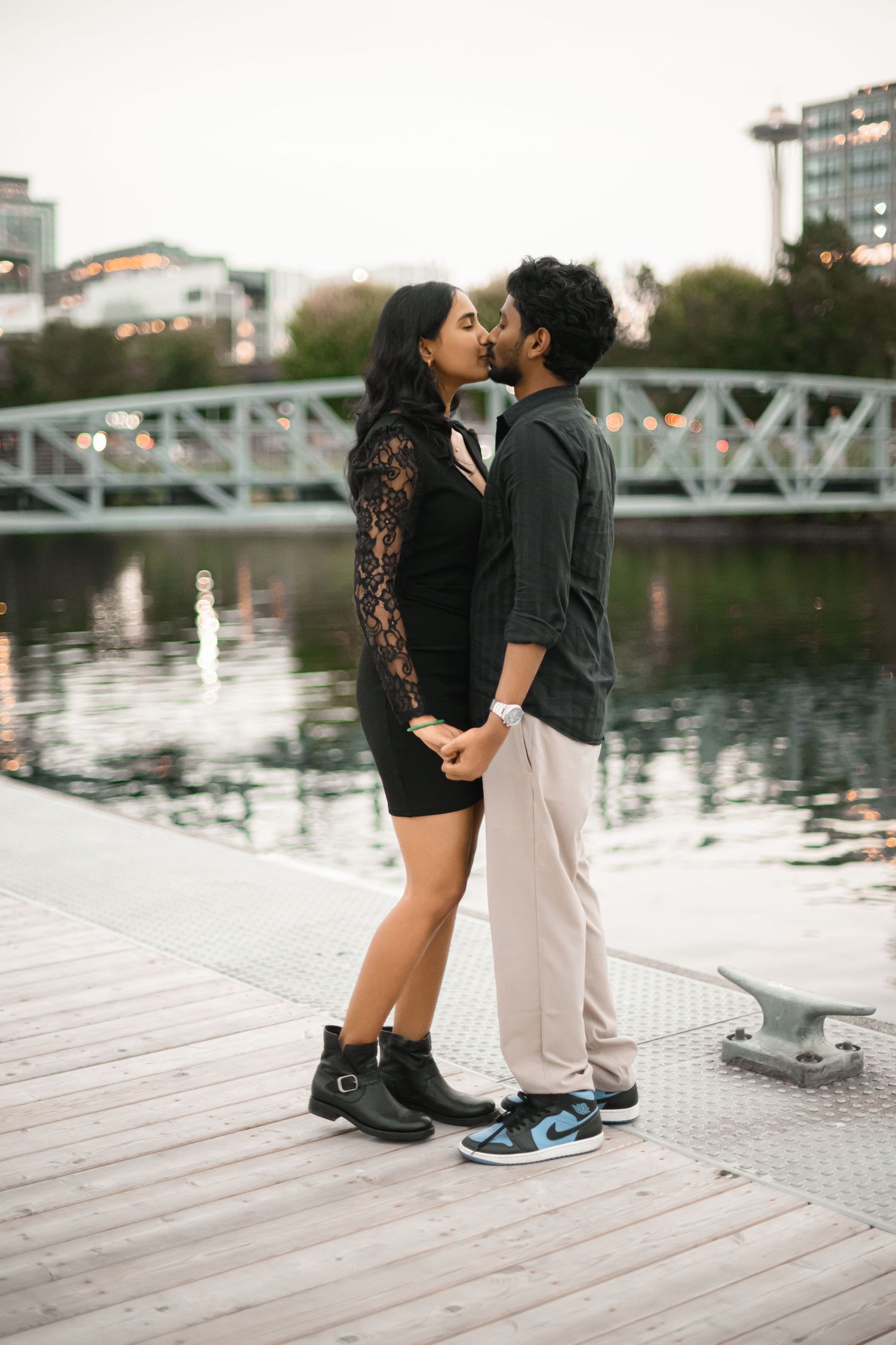 Newly engaged couple kissing on the dock at Lake Union Park, Lake Union proposal photographer, Seattle