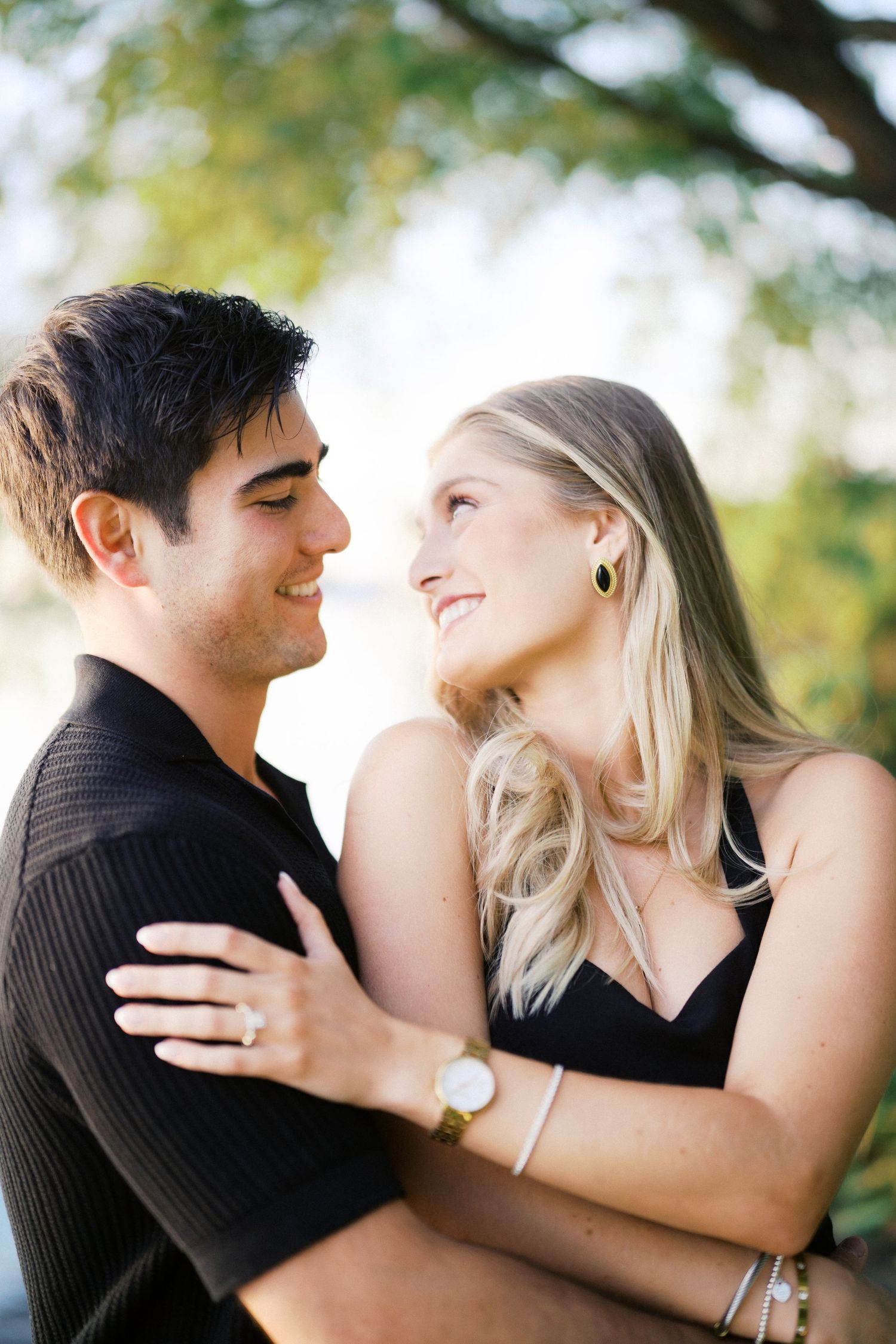 The couple looking at each other after the proposal at Carillon Point in Kirkland