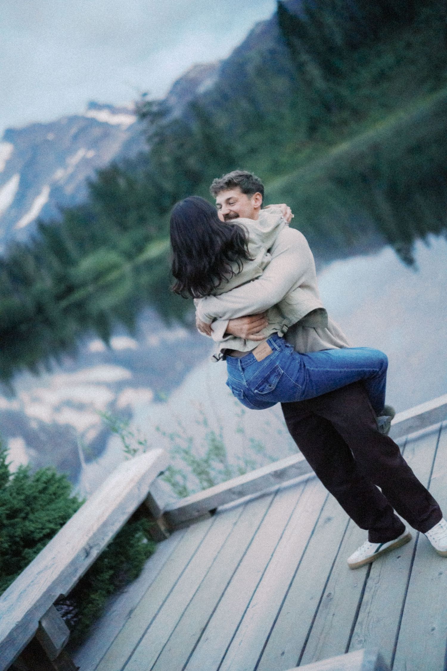 He lifts her off her feet at Picture Lake, Artist Point proposal photographer, Mt Baker