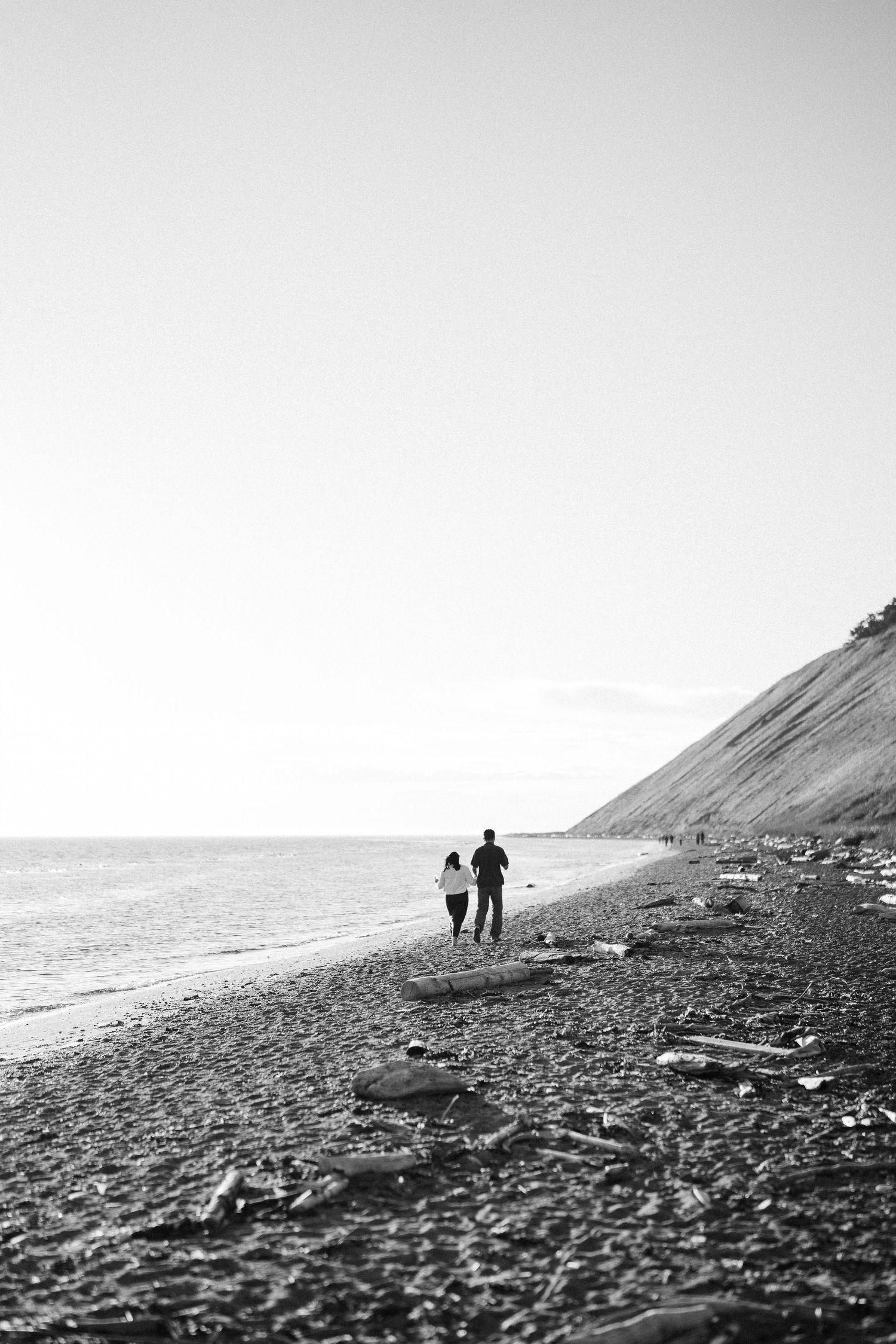 Black and white wide view of the pebble beach and the bluff, Whidbey Island proposal photographer, Whidbey Island