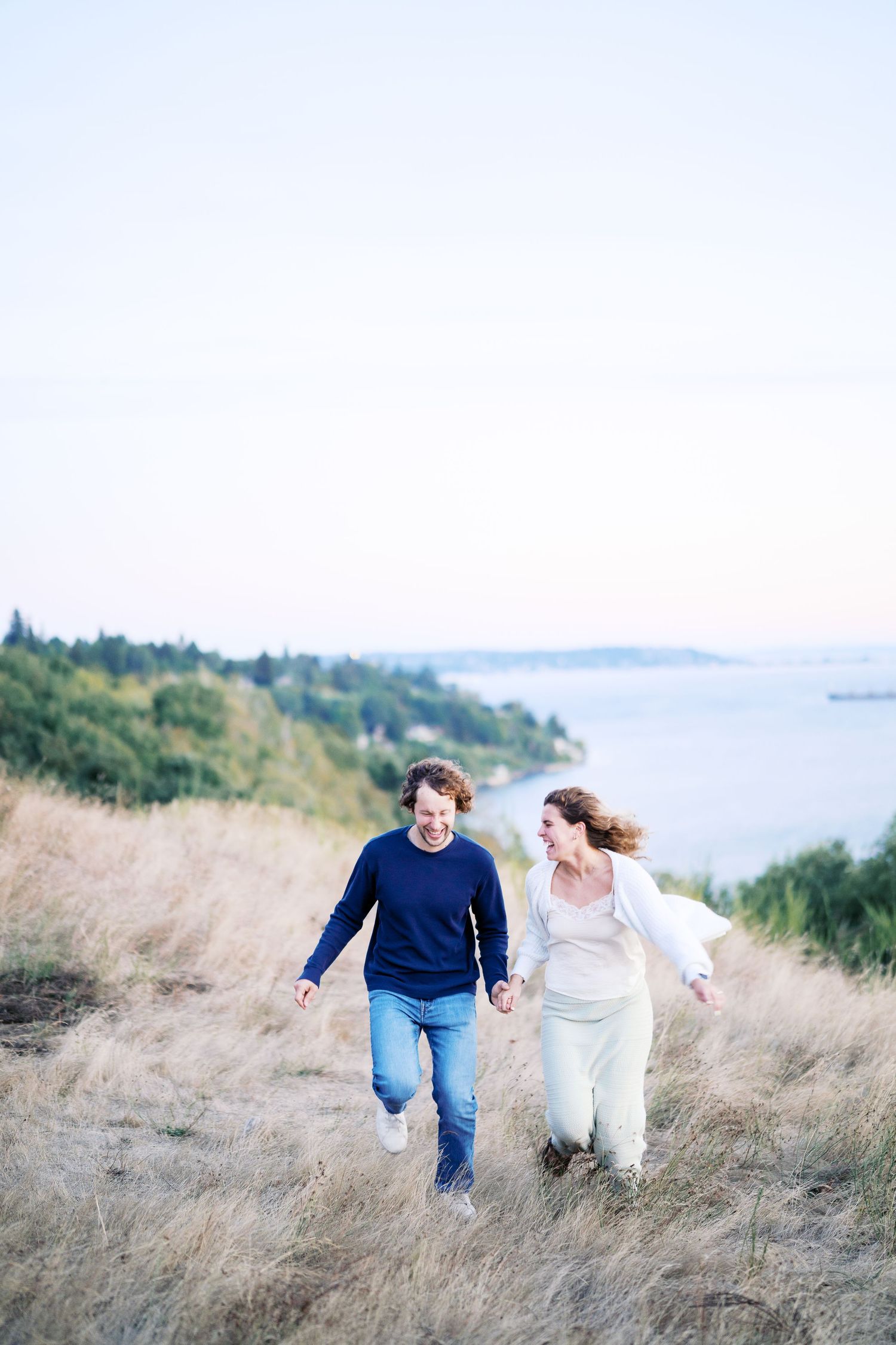 Crossing the meadow toward the overlook, Discovery Park proposal photographer, Seattle