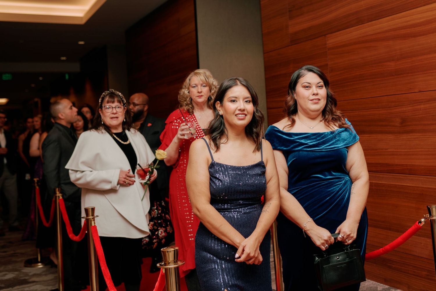 Guests gathered by the rope line in formalwear, Seattle area corporate gala photographer, Renton