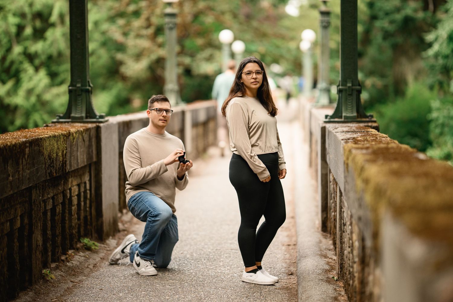 Surprise proposal on one knee on the Wilcox Footbridge, Washington Park Arboretum proposal photographer, Seattle