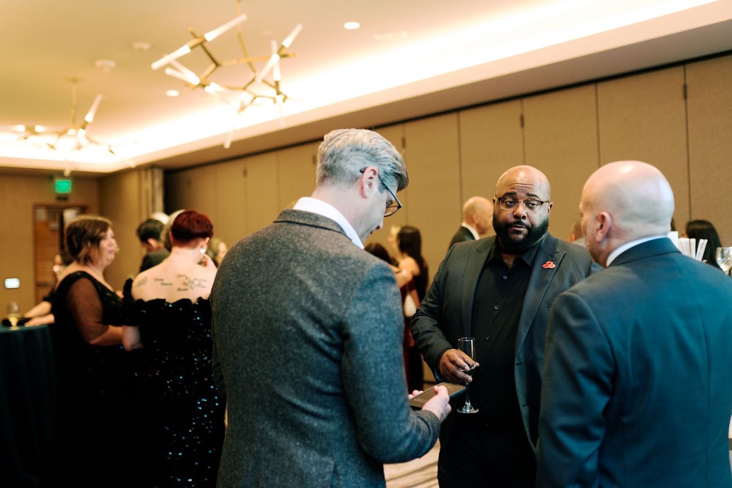 Guests talking during the reception, corporate event photography at the Hyatt Regency Lake Washington, Renton