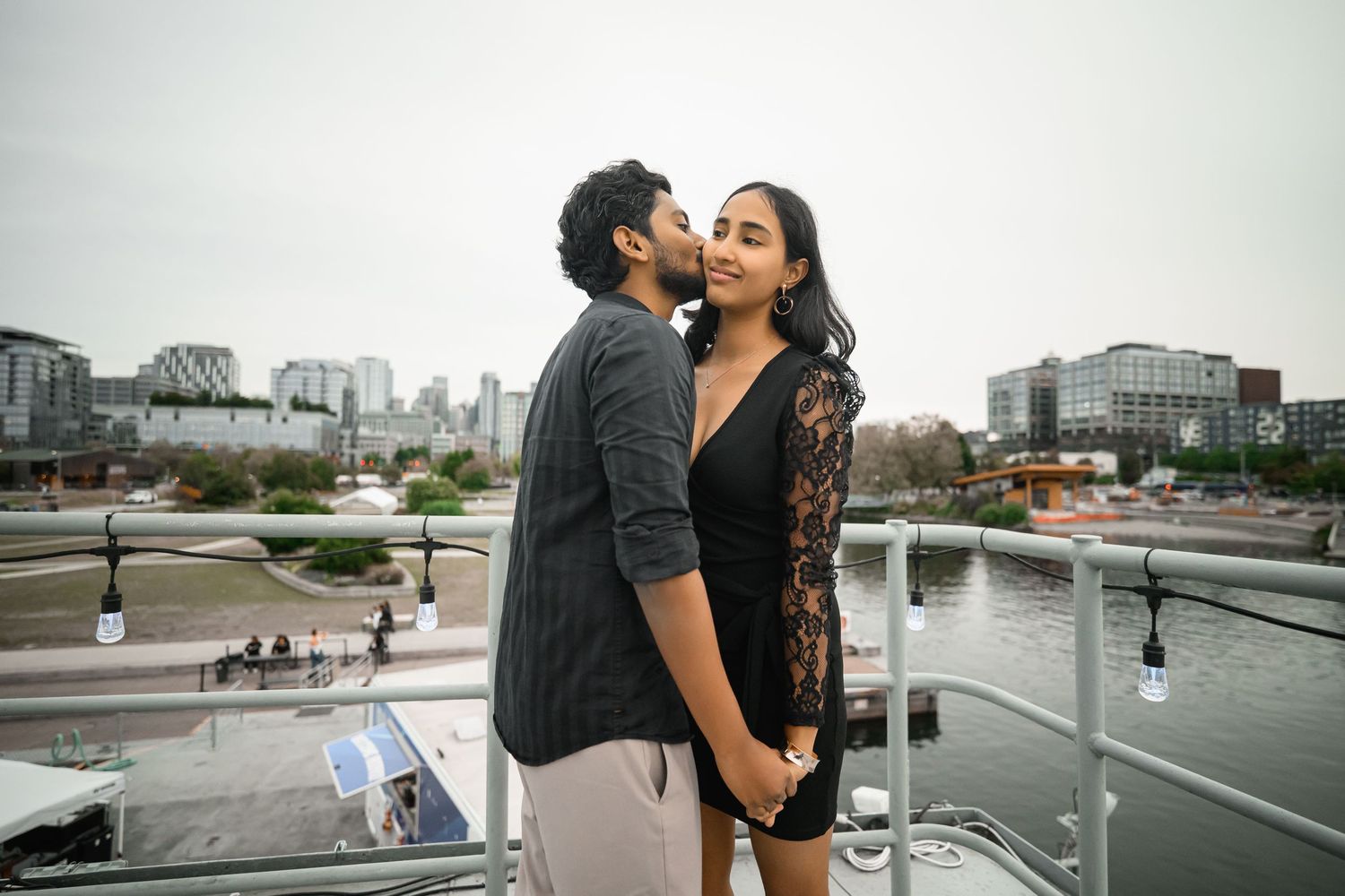 Engagement portrait at the water's edge with Lake Union behind them, Lake Union proposal photographer, Seattle