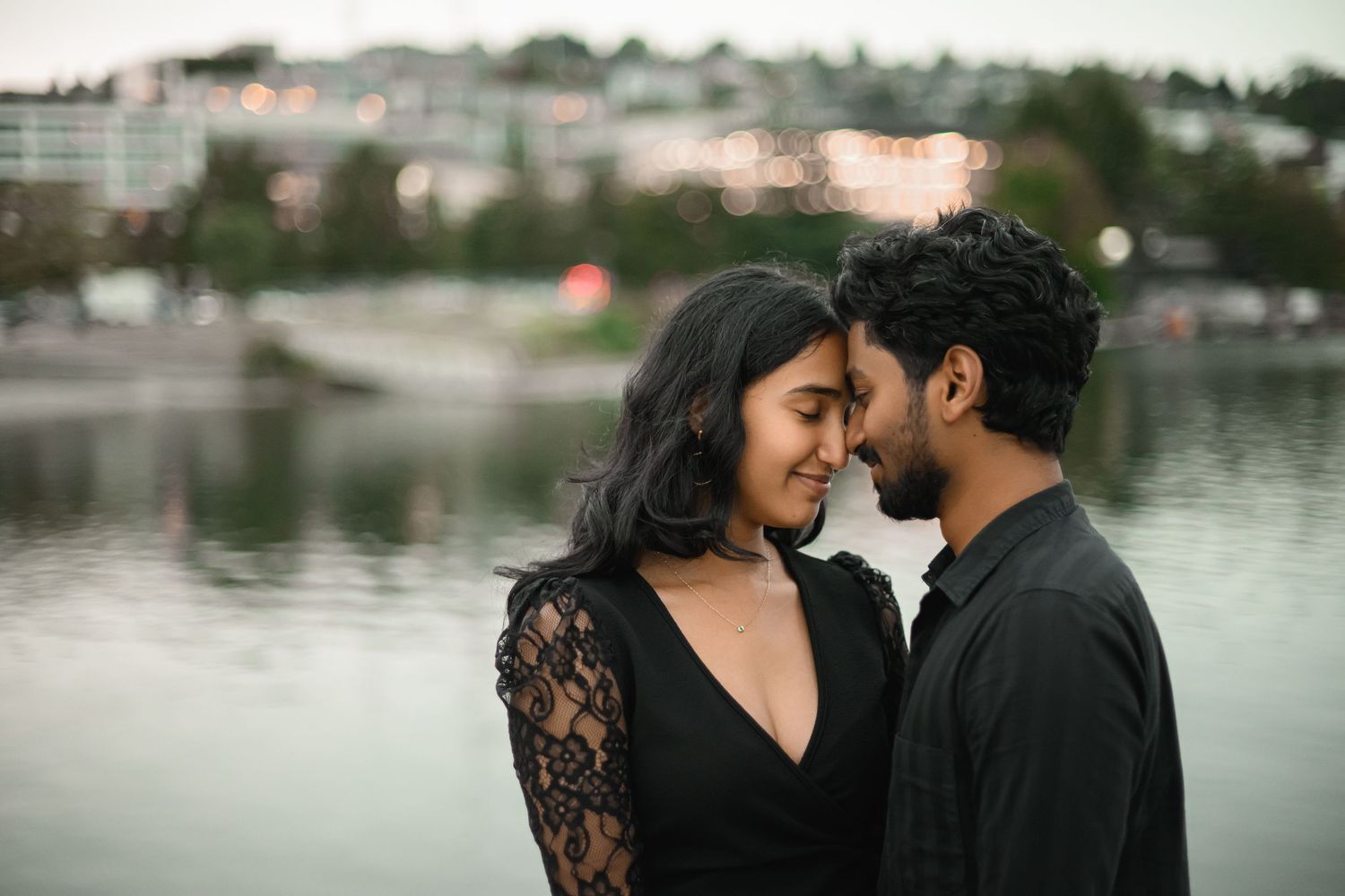 Foreheads together at the railing above Lake Union after the proposal, Lake Union proposal photographer, Seattle