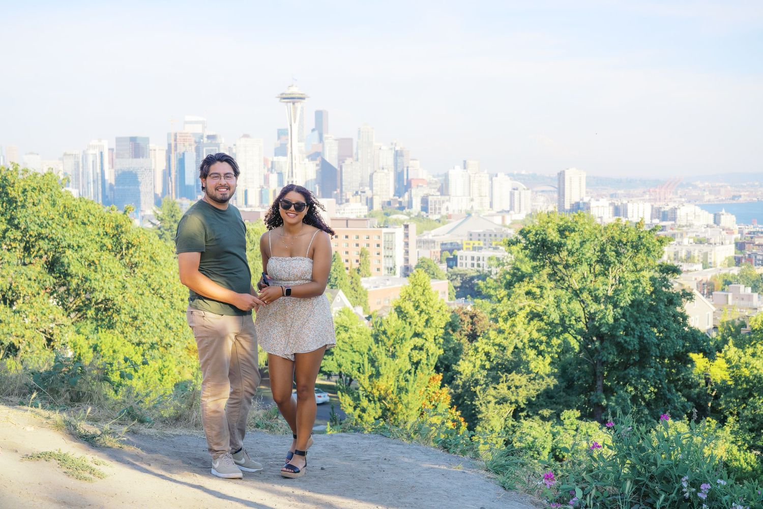 He reaches for the ring box moments before the question, Kerry Park proposal photography, Seattle