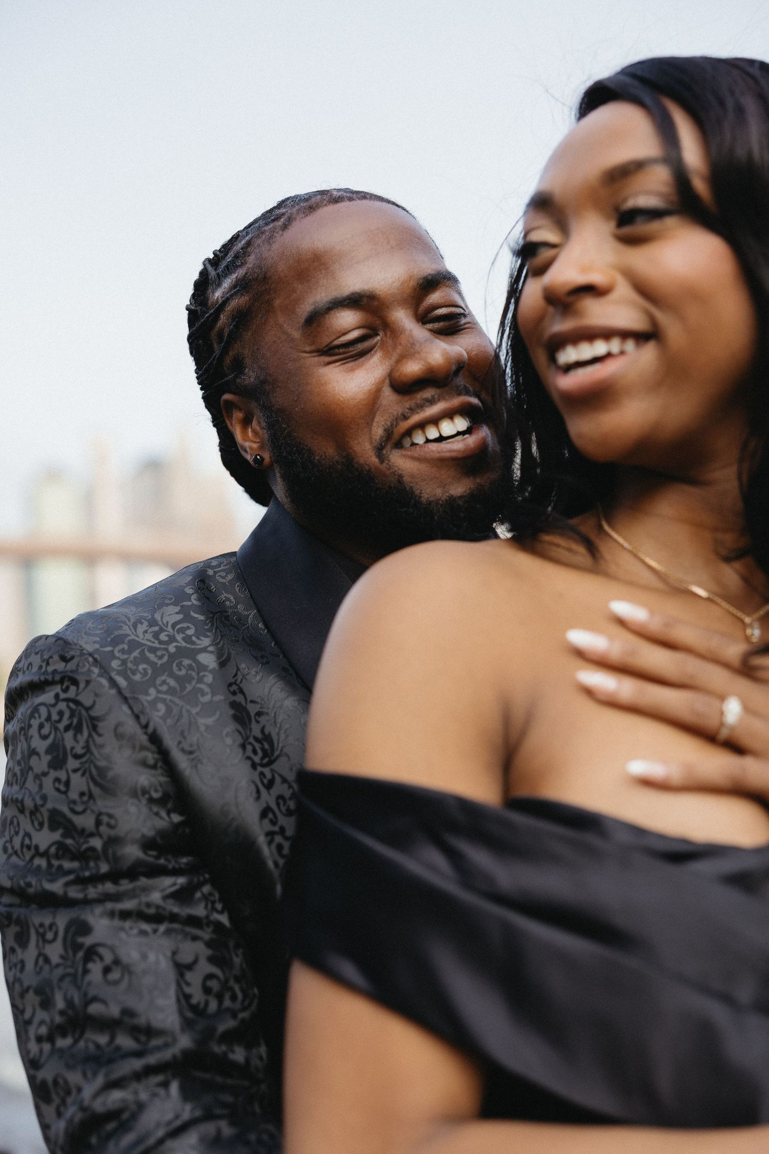 Intimate close-up of couple sharing tender moment against white background.