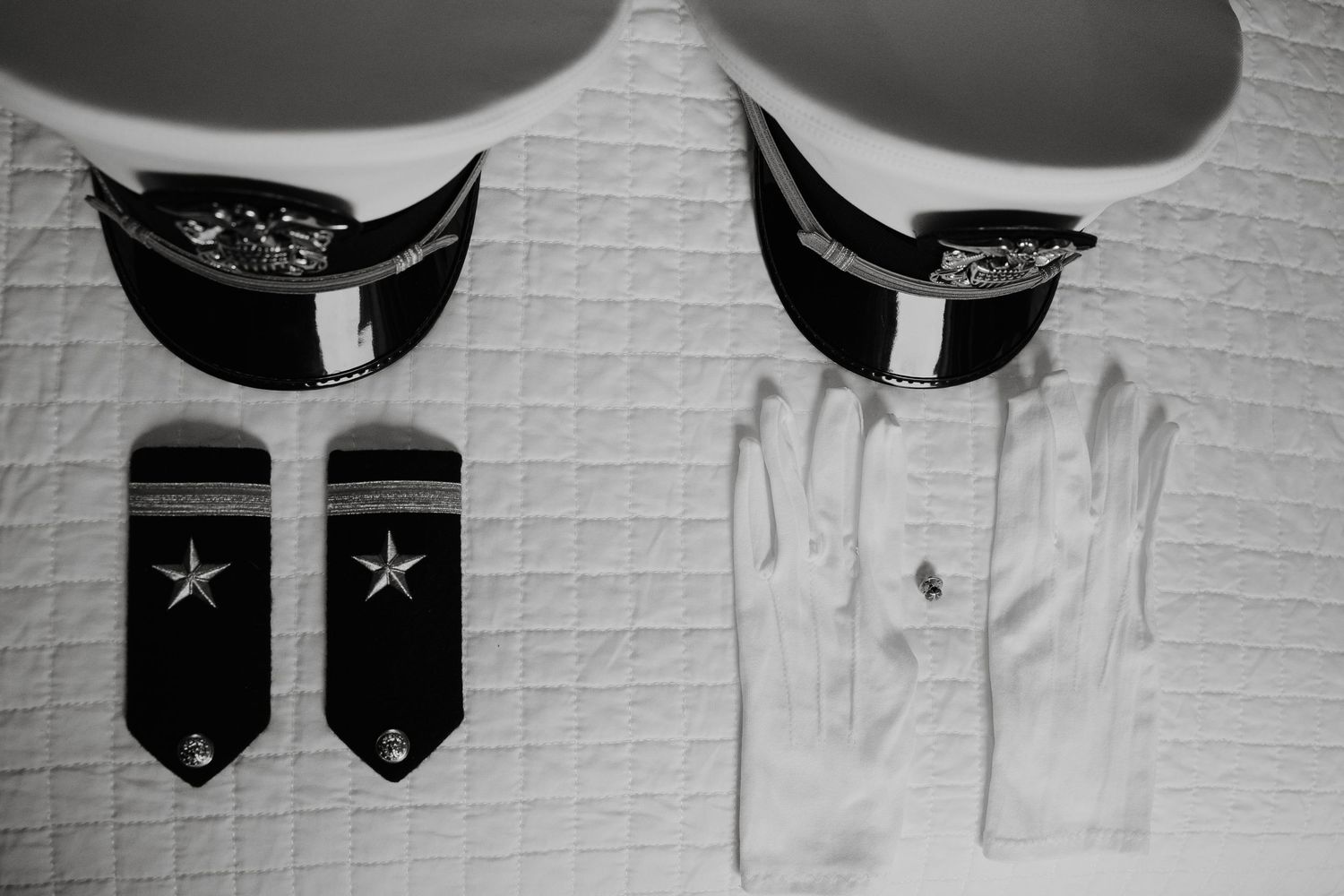 Military uniform shoulder boards with stars arranged in a symmetrical display.