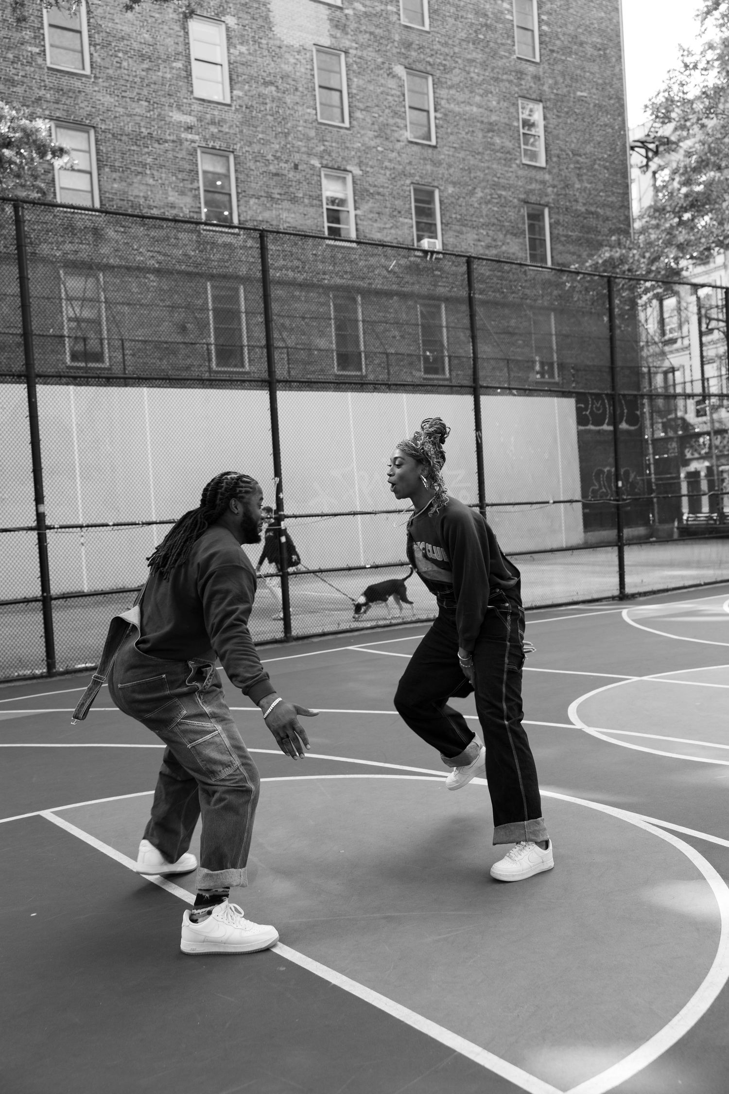 Black and white sequence of dance movements on a basketball court.