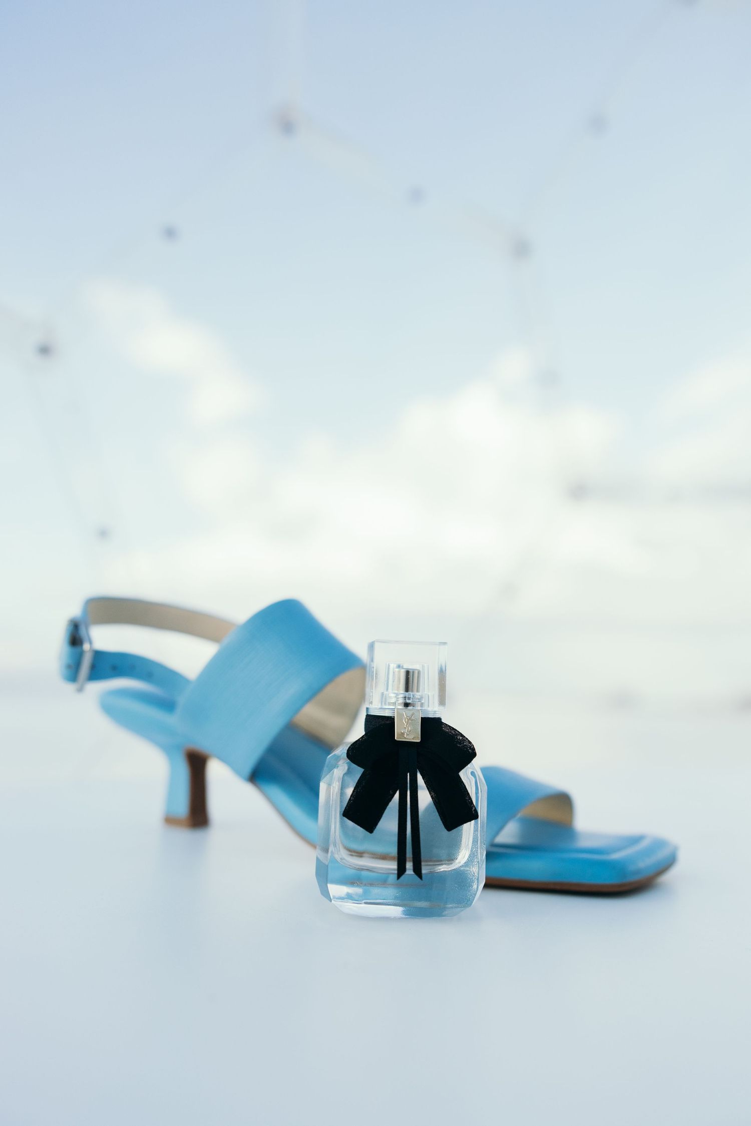 Light blue wedding heels photographed against a white background.
