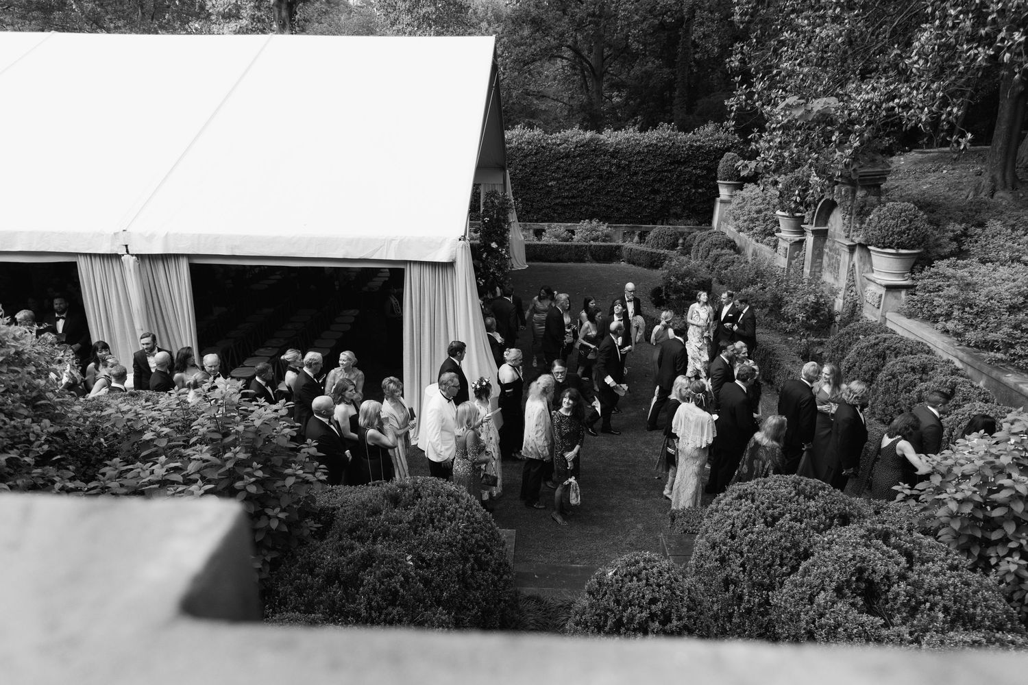 Black and white panoramic photo showing a crowd gathered at an outdoor event.