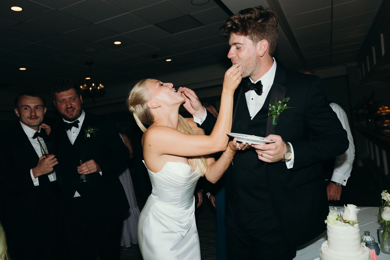 Wedding reception dance floor with couples dancing in formal attire.