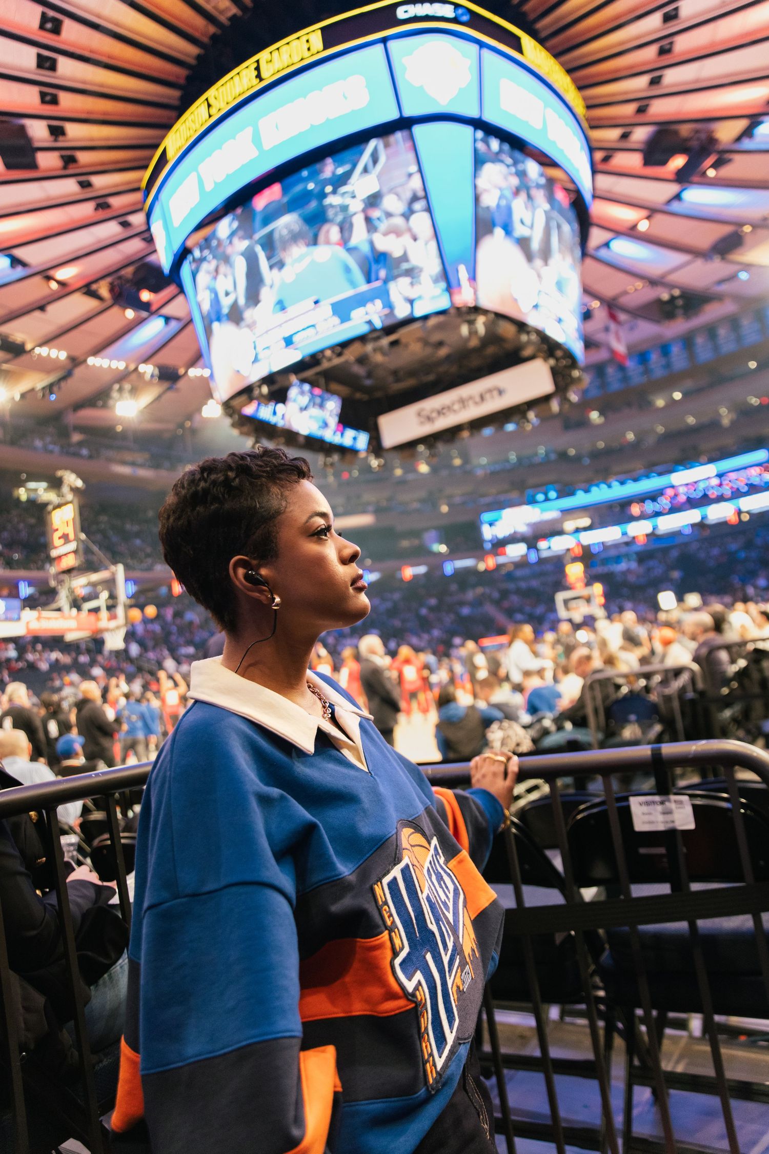Maleah Joi Moon uniform watches game from Madison Square Garden arena seats.
