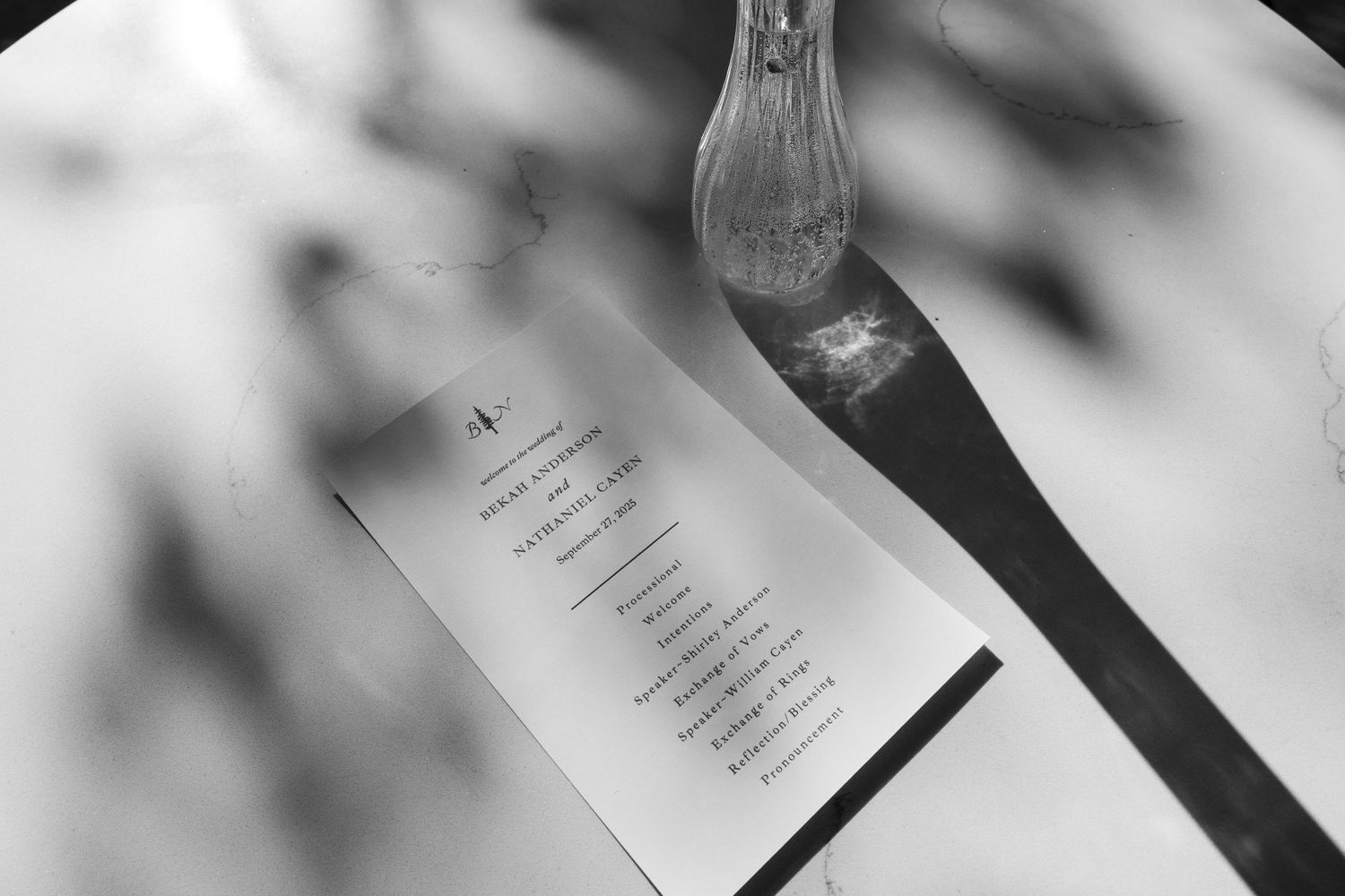 Black and white detail shot of wedding ceremony programs.