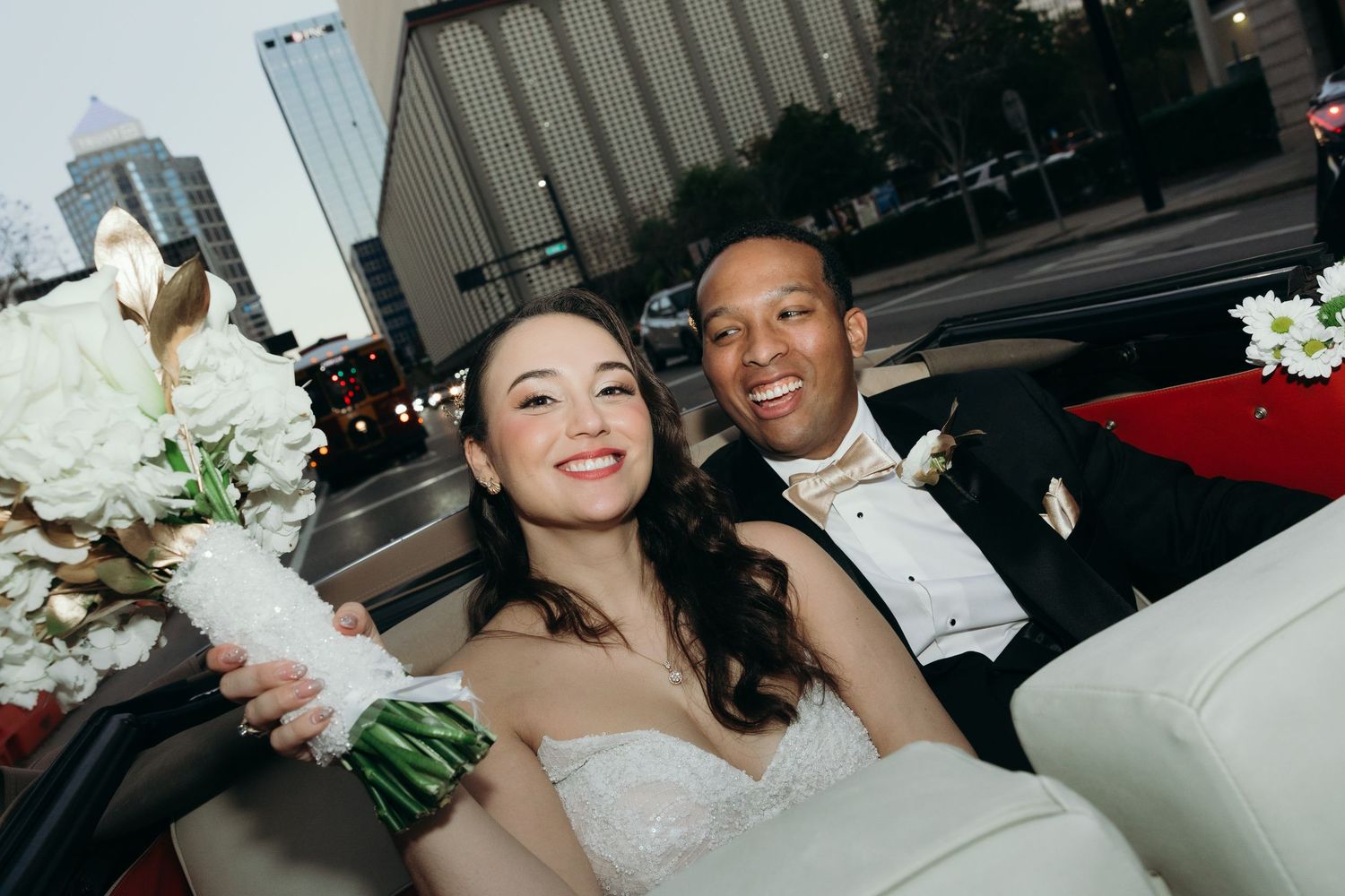 A series of wedding photos showing couples celebrating at a reception venue with white floral decorations.