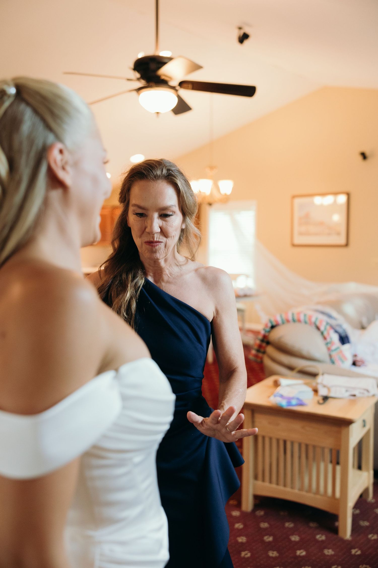 Getting ready moments captured in a warm-lit room before the ceremony.