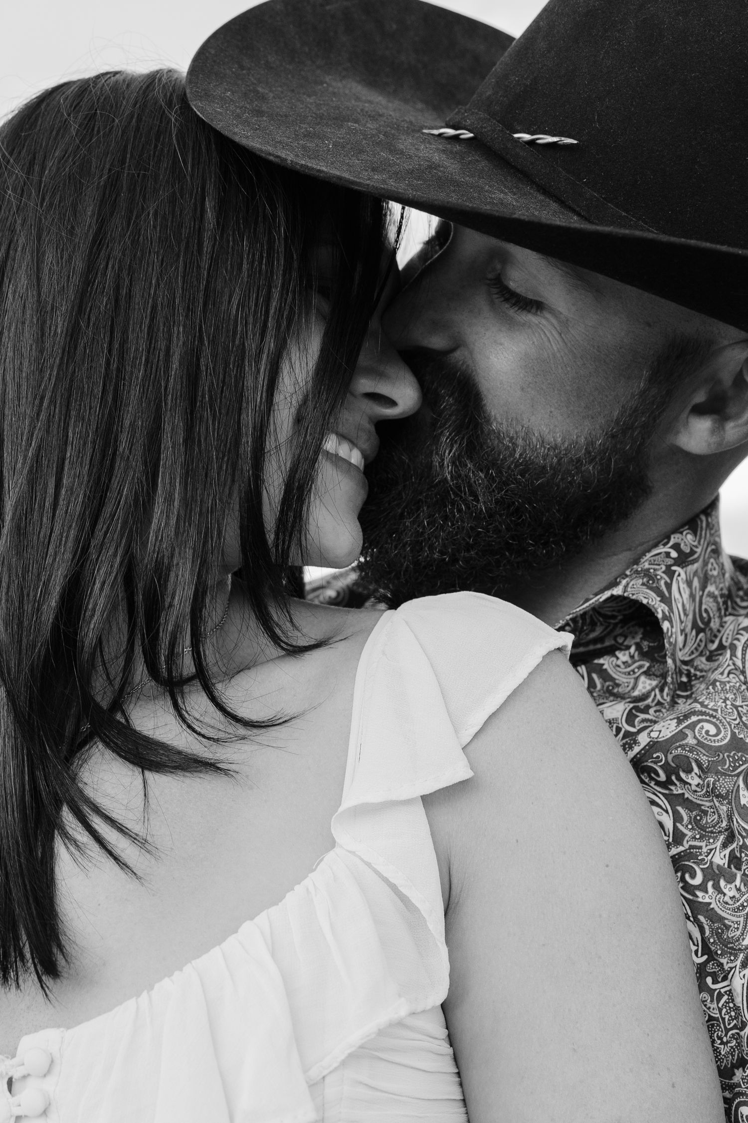 Close-up black and white intimate portrait sequence of a couple.