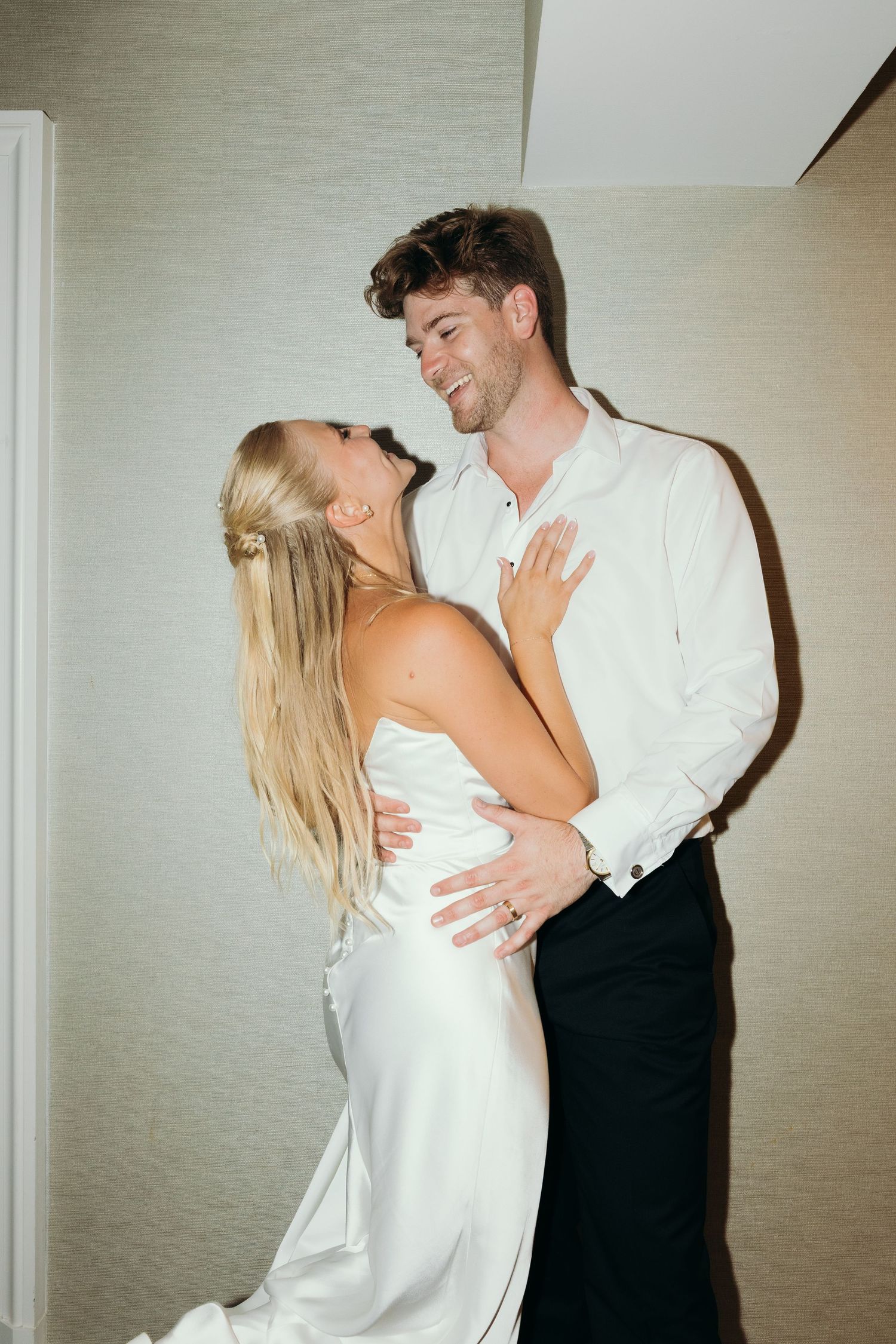 A couple in formal attire sharing an intimate dance moment.