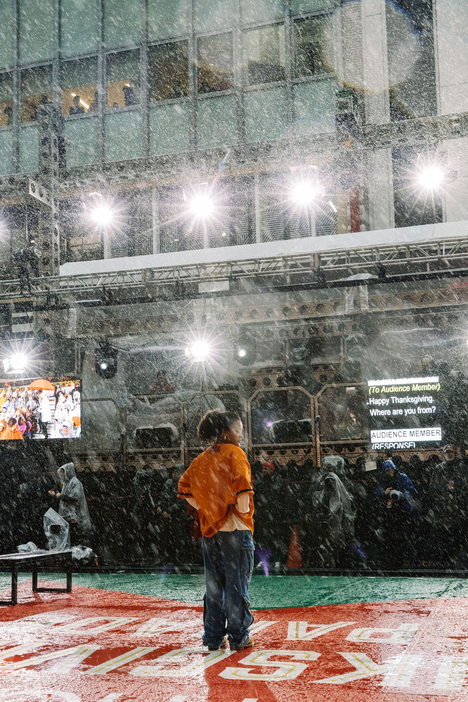 Snowy indoor event space with bright overhead lights creating a dramatic atmosphere.