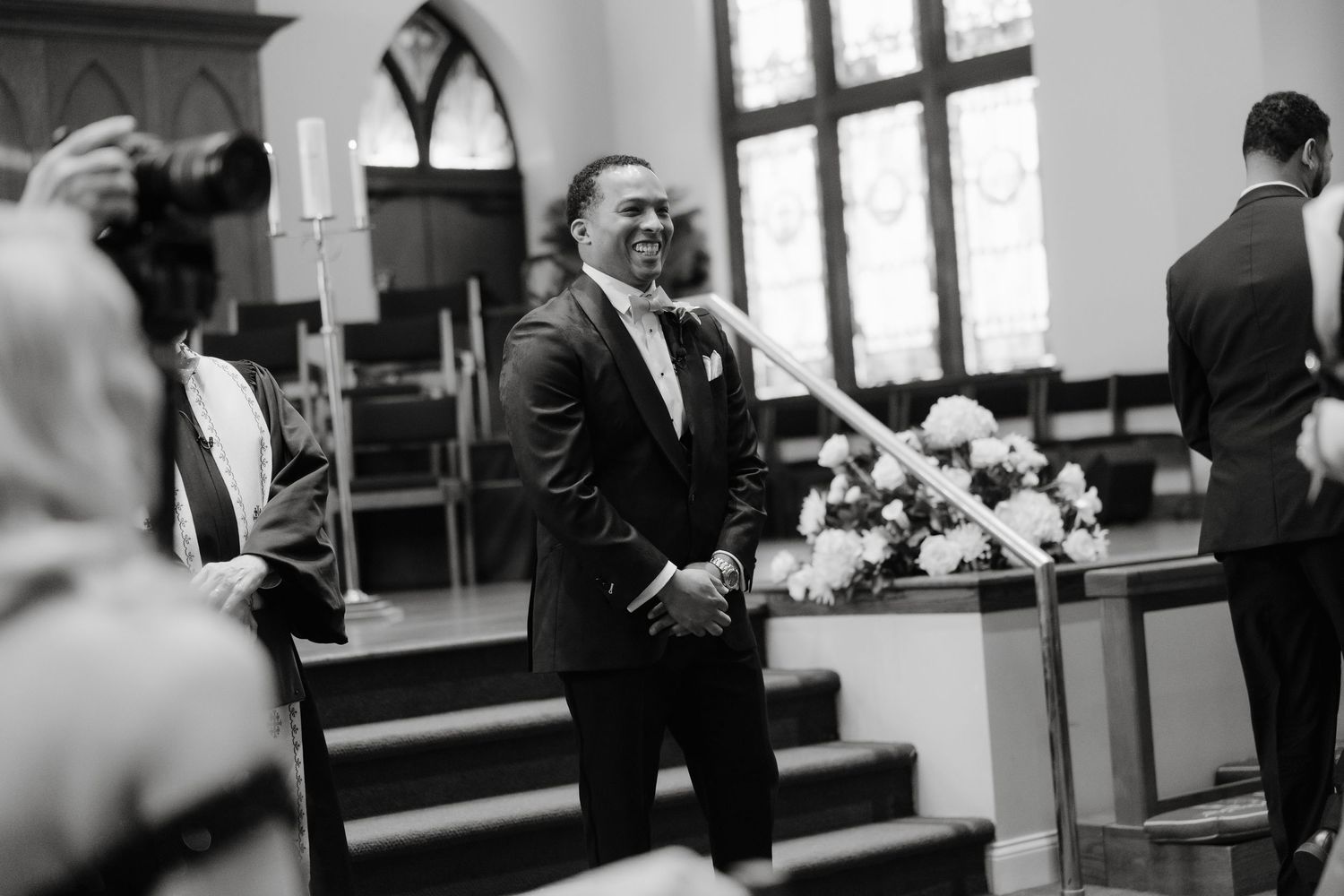 Black and white wedding photo collage showing intimate moments during a ceremony and reception.