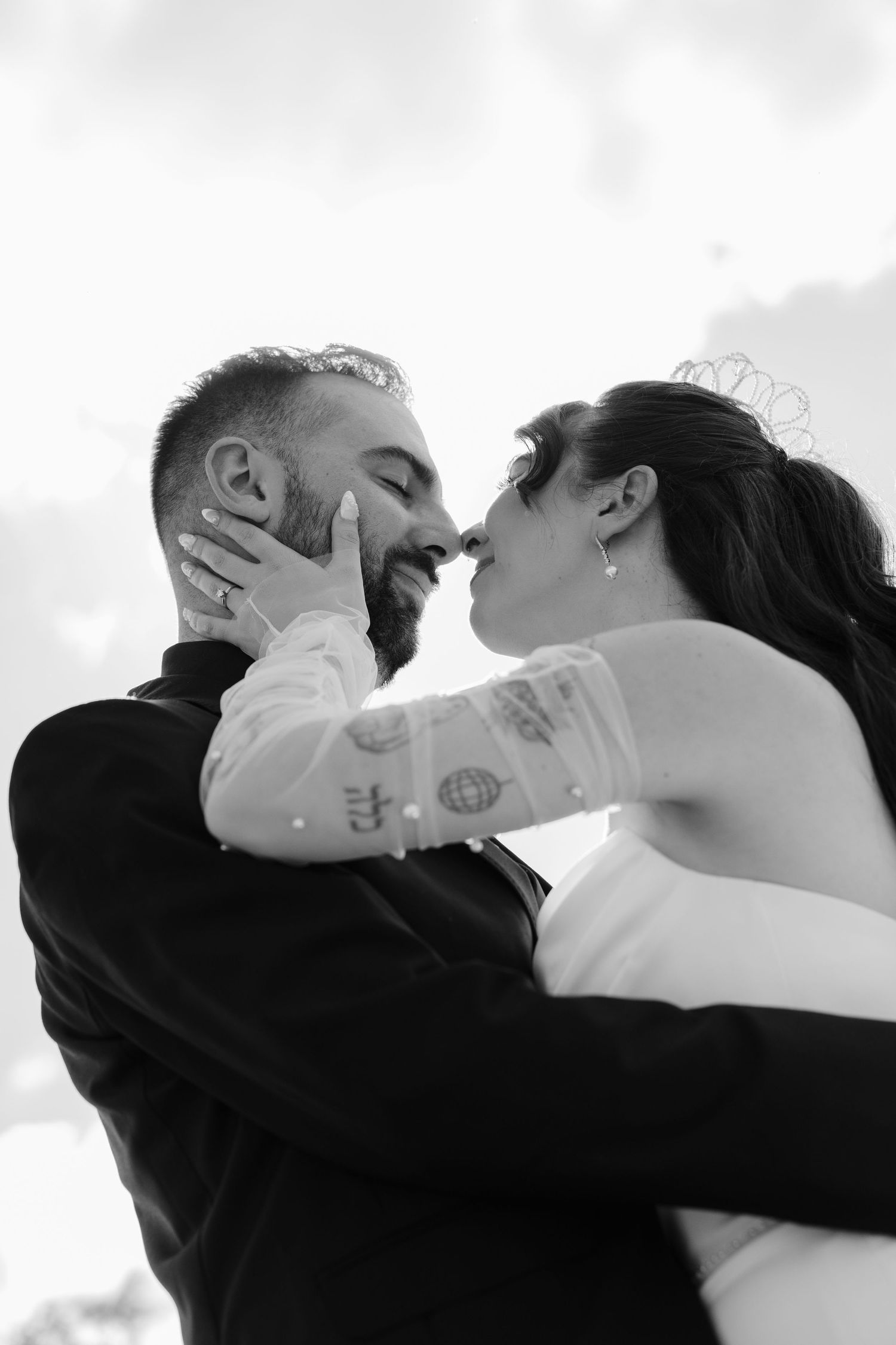 A romantic black and white sequence of a couple sharing a kiss in multiple frames.