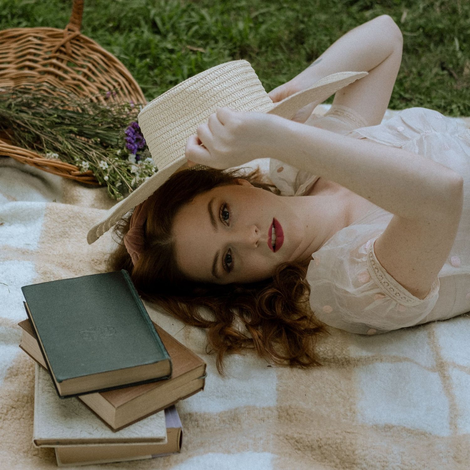 Photo of a girl in a garden wearing a vintage dress