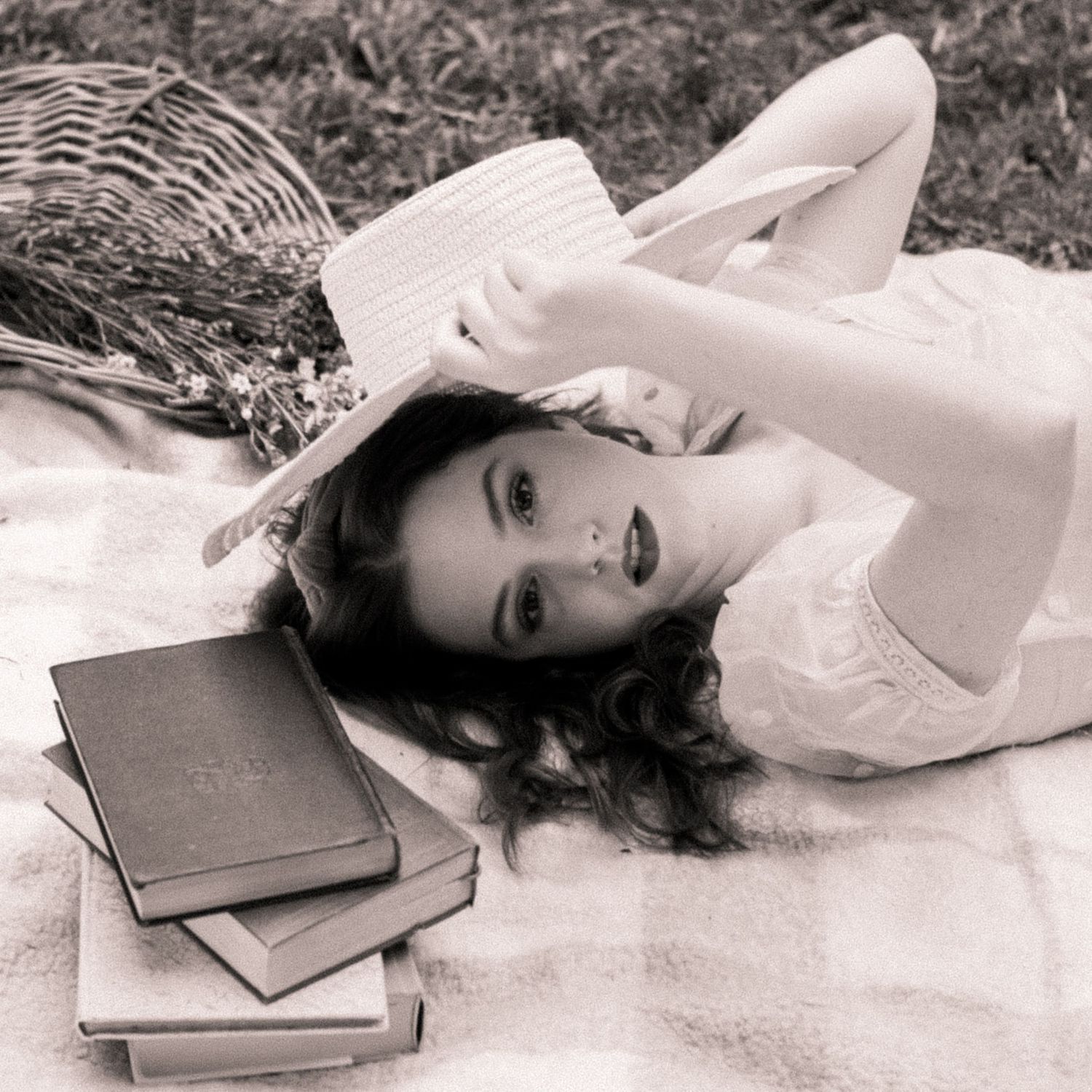 Photo of a girl in a garden wearing a vintage dress
