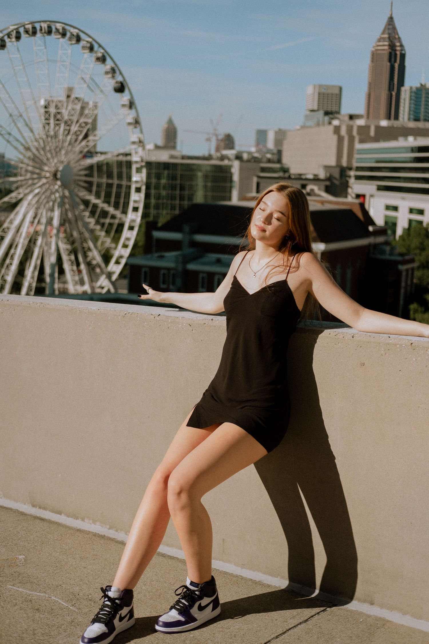 Photo of a high school senior with the Atlanta skyline