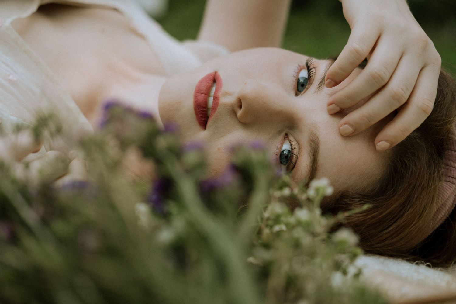 Photo of a girl in a garden wearing a vintage dress