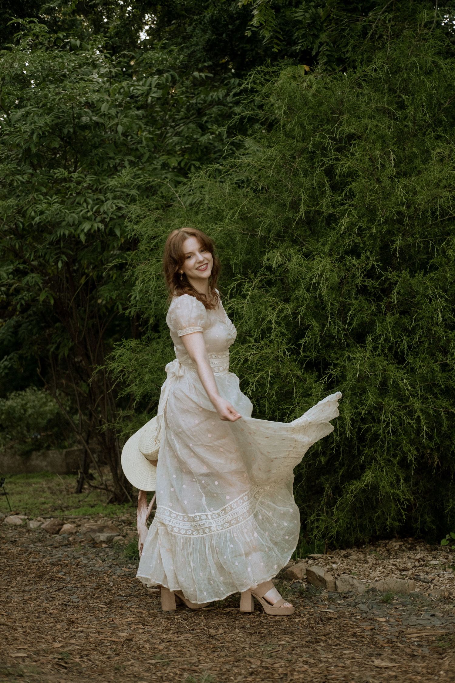 Photo of two girls in a forest wearing a vintage dress