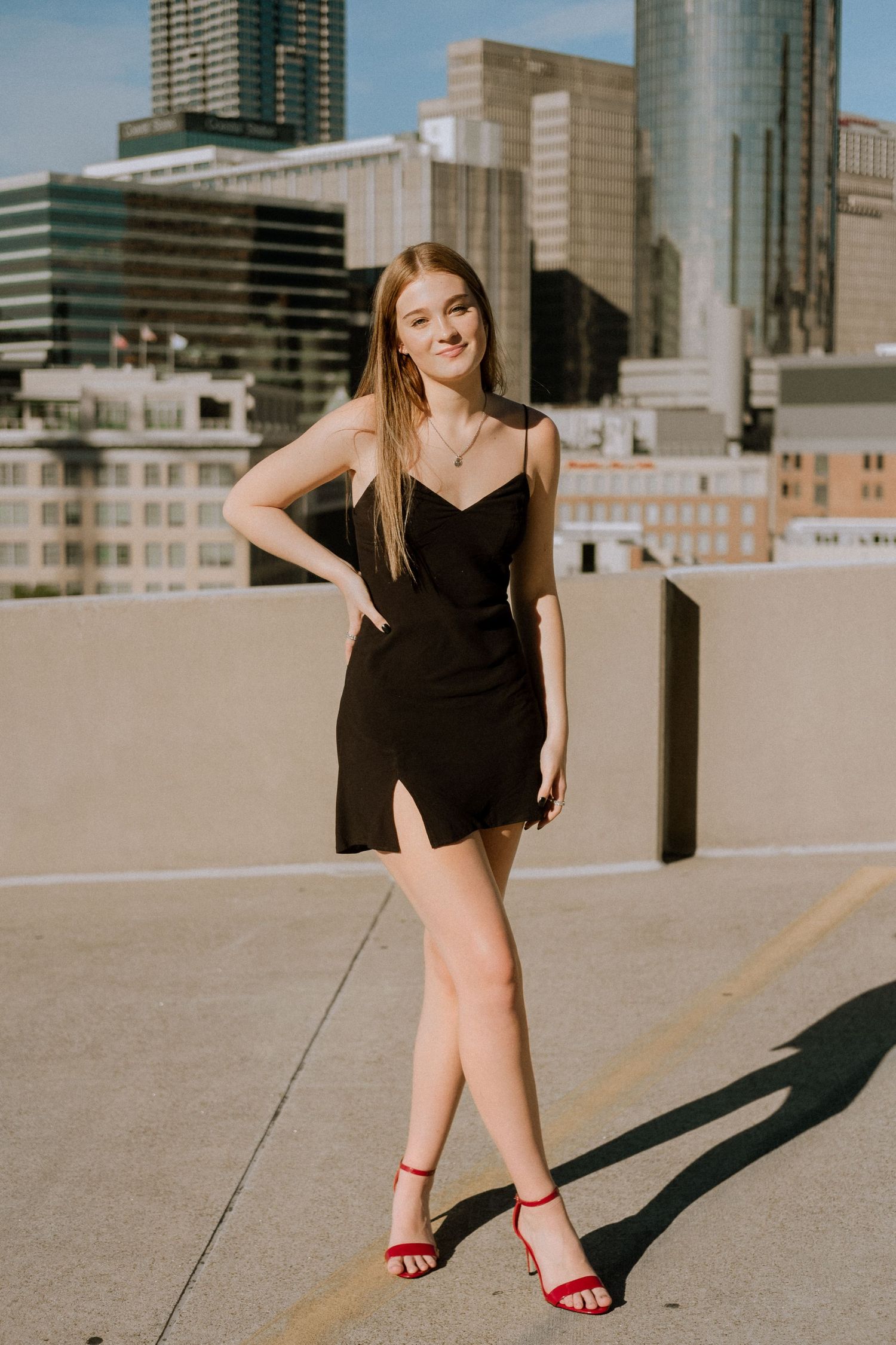 Photo of a high school senior with the Atlanta skyline