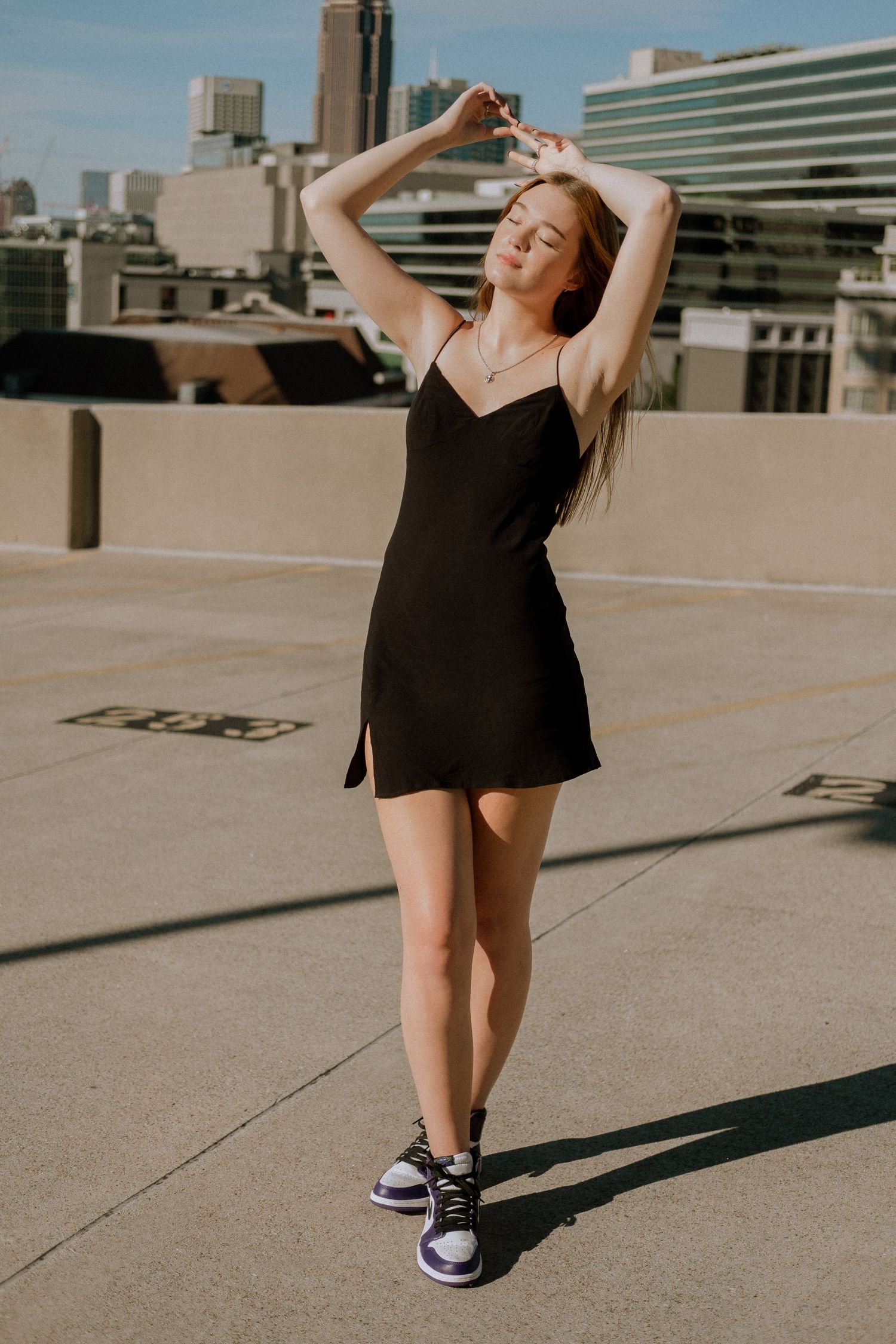 Photo of a high school senior with the Atlanta skyline