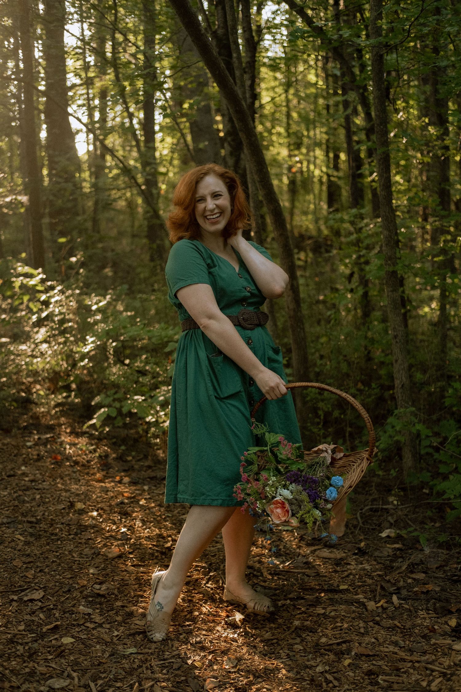 Photo of two girls in a forest wearing a vintage dress