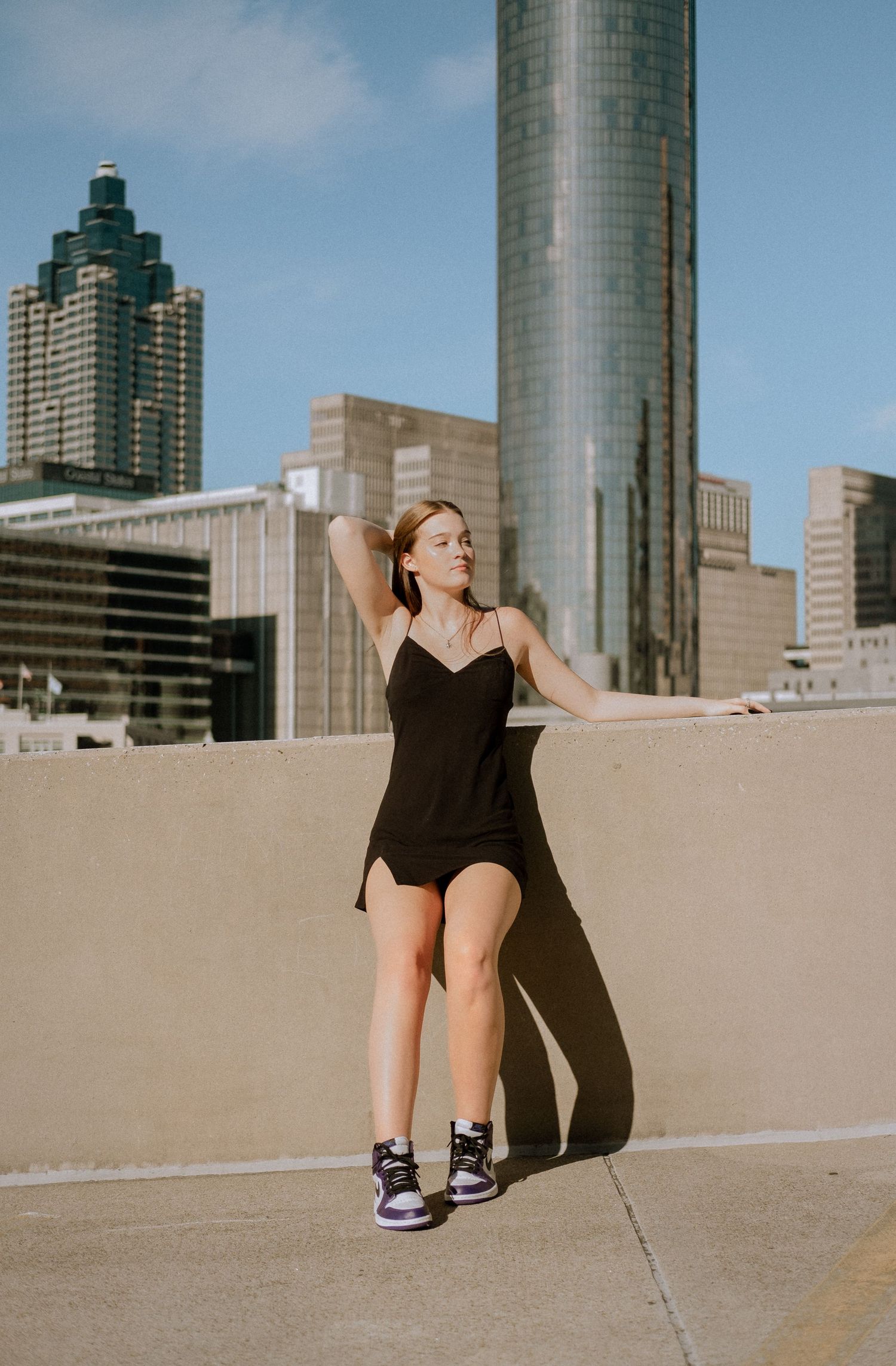 Photo of a high school senior with the Atlanta skyline
