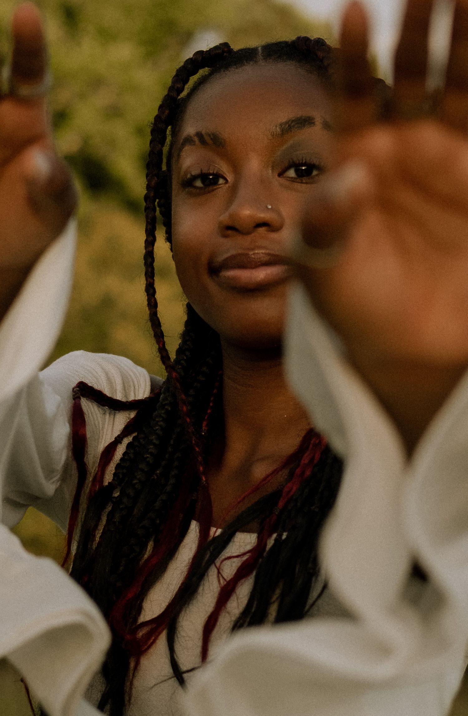 Photo of a senior girl reaching towards the camera